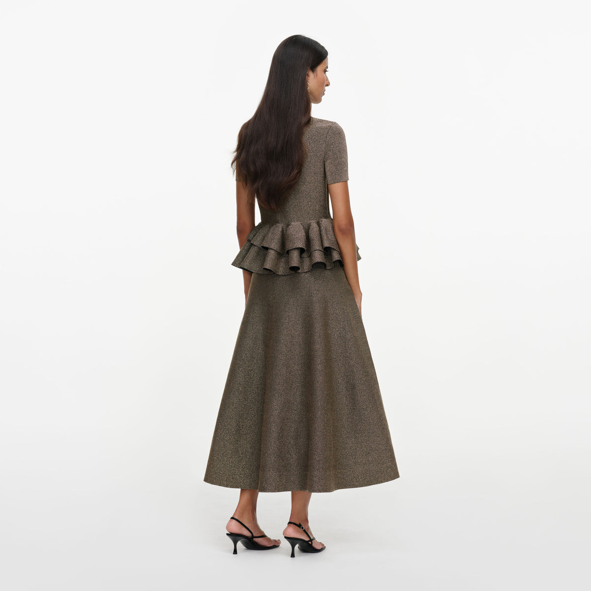 Back view of a woman wearing the Bronze Peplum Knit Midi Dress