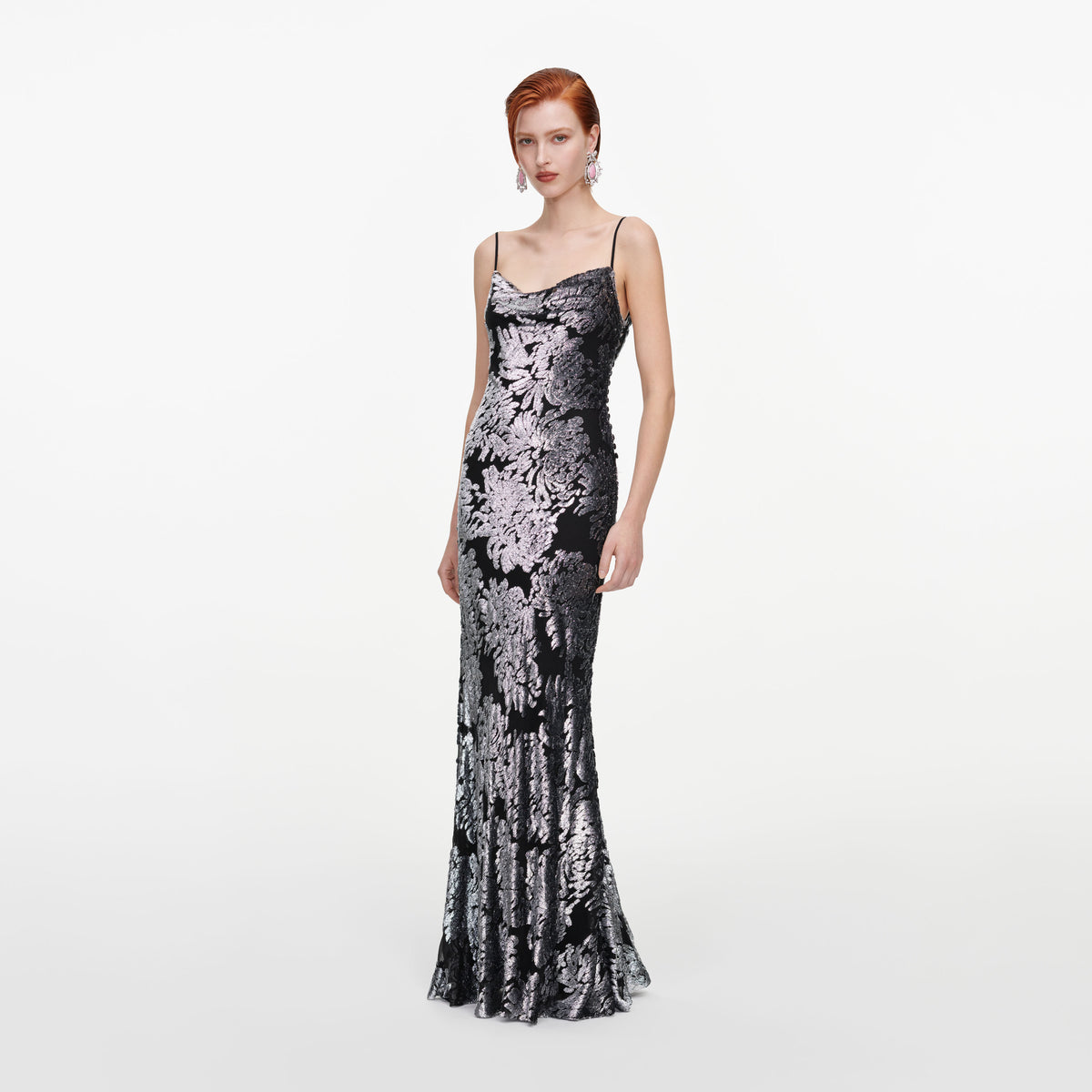 Side view of a woman wearing the Silver Fil Coupe Maxi Dress