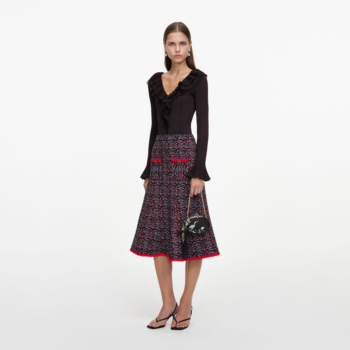 Side view of a woman wearing the Multi Textured Knit Midi Skirt