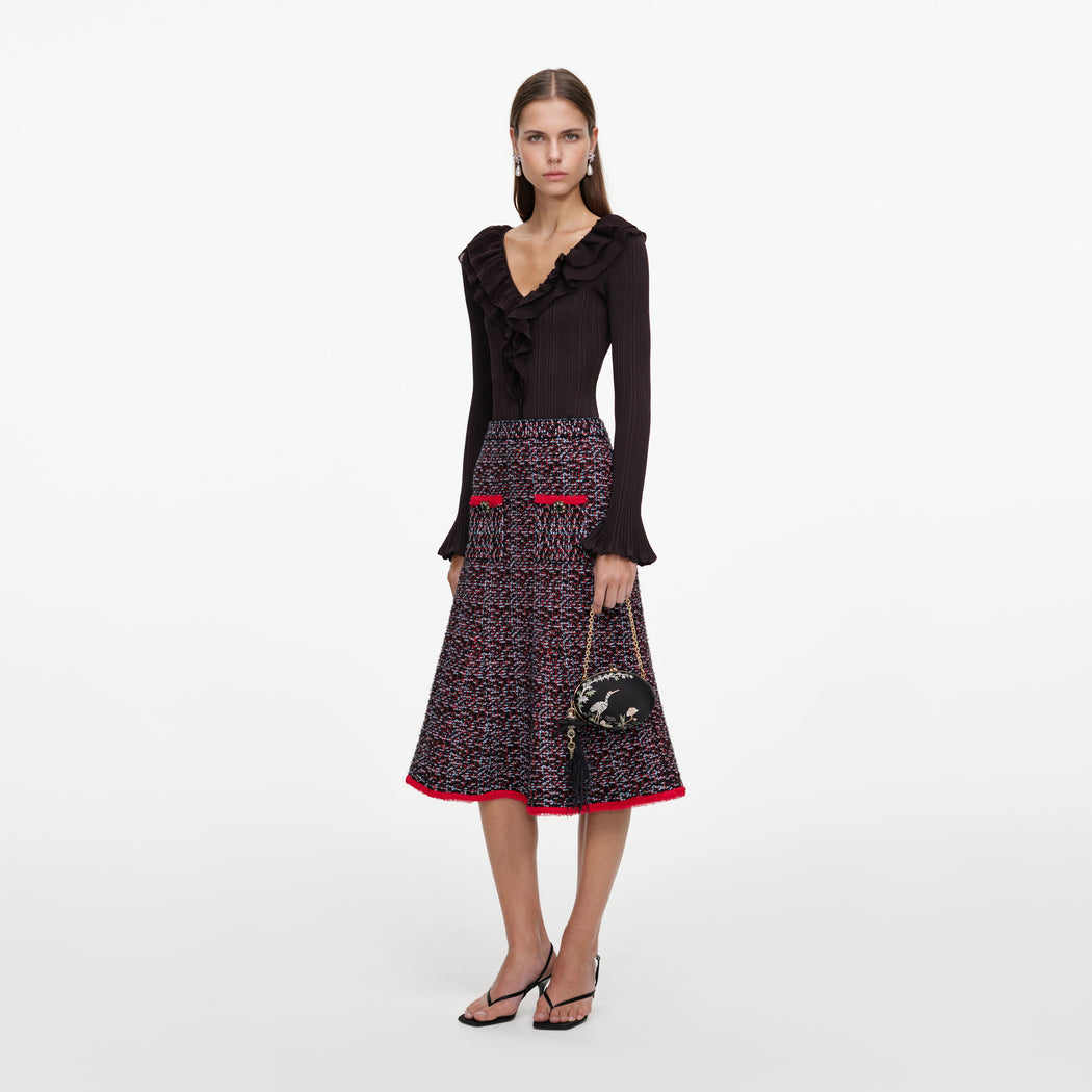 Side view of a woman wearing the Multi Textured Knit Midi Skirt