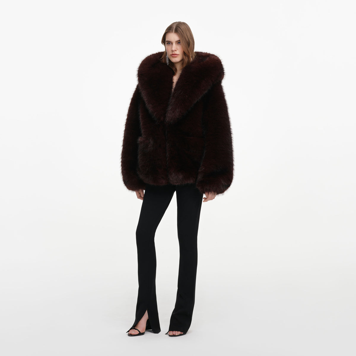Side view of a woman wearing the Brown Faux Fur Hooded Jacket