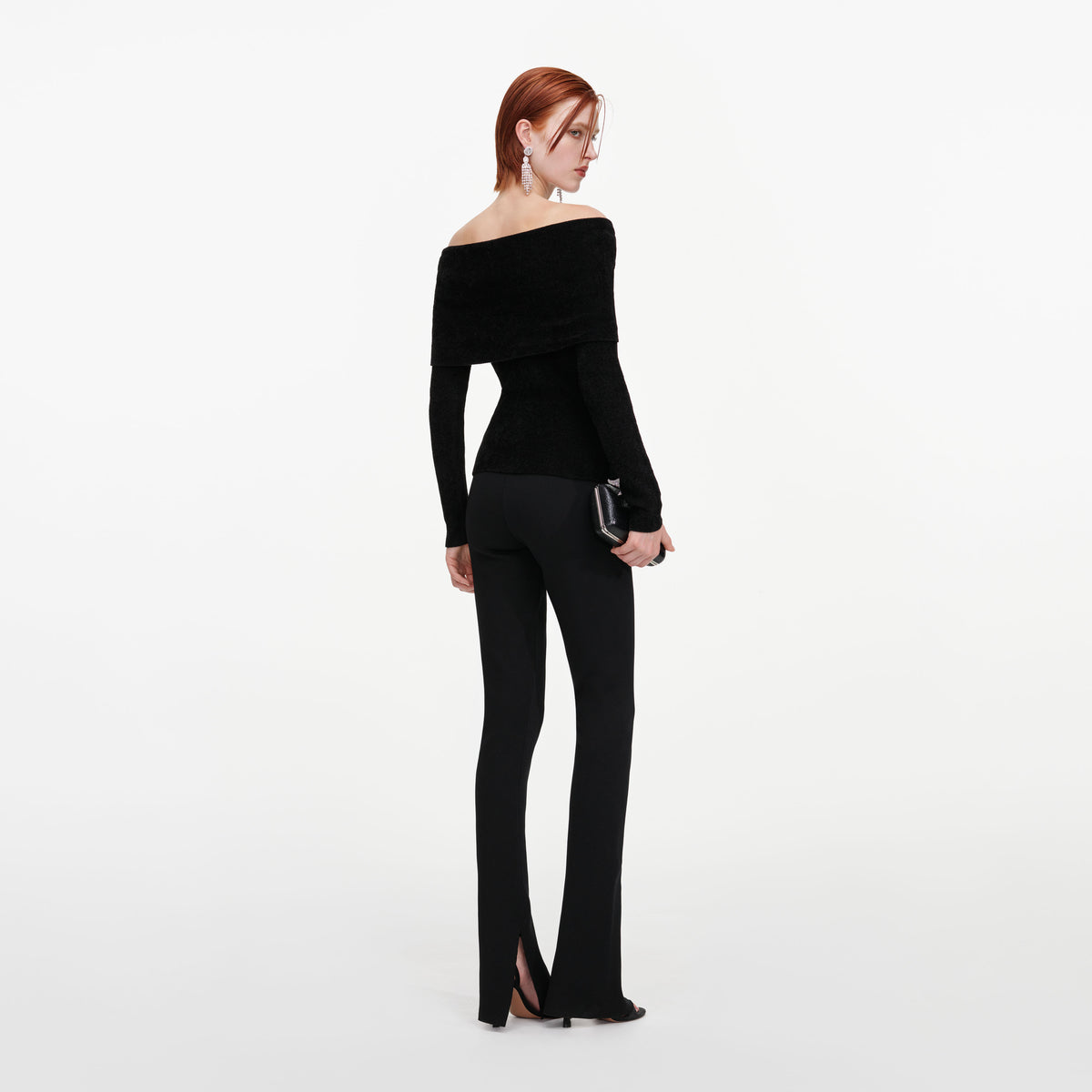 Back view of a woman wearing the Black Brooch Chenille Knit Top