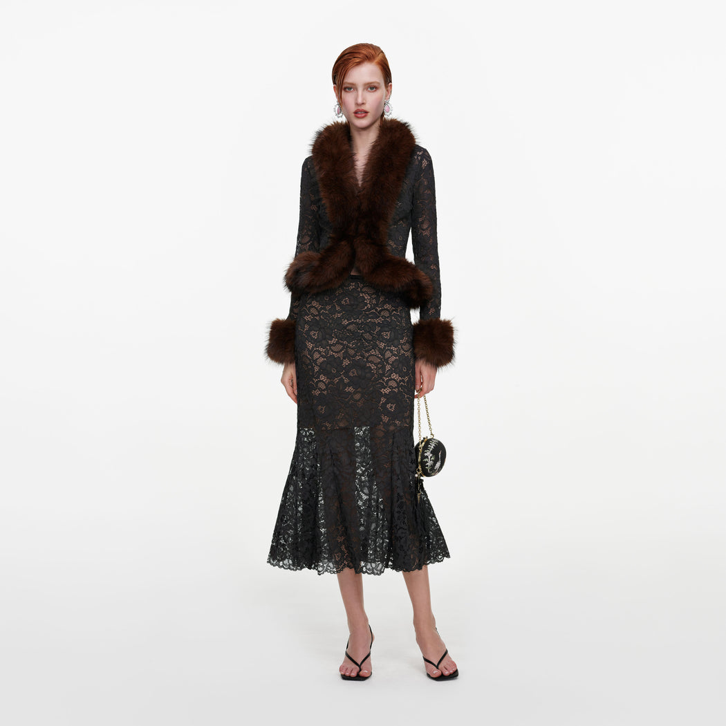 Front view of a woman wearing the Grey Lace Midi Skirt