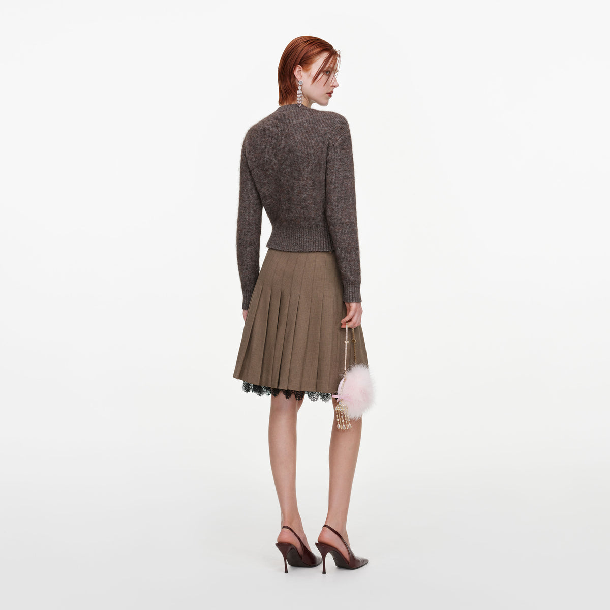 Back view of a woman wearing the Brown Twill Lace Pleated Midi Skirt
