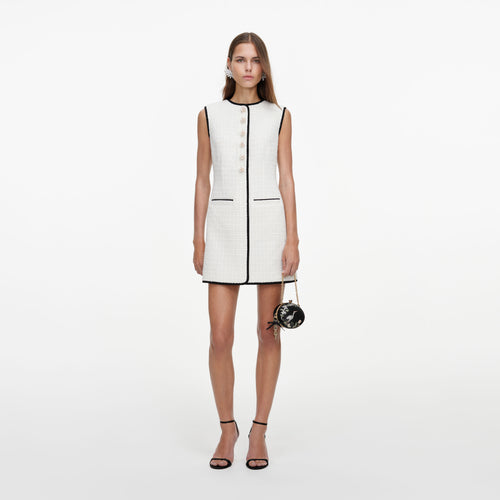 Front view of a woman wearing the Cream Sleeveless Boucle Mini Dress