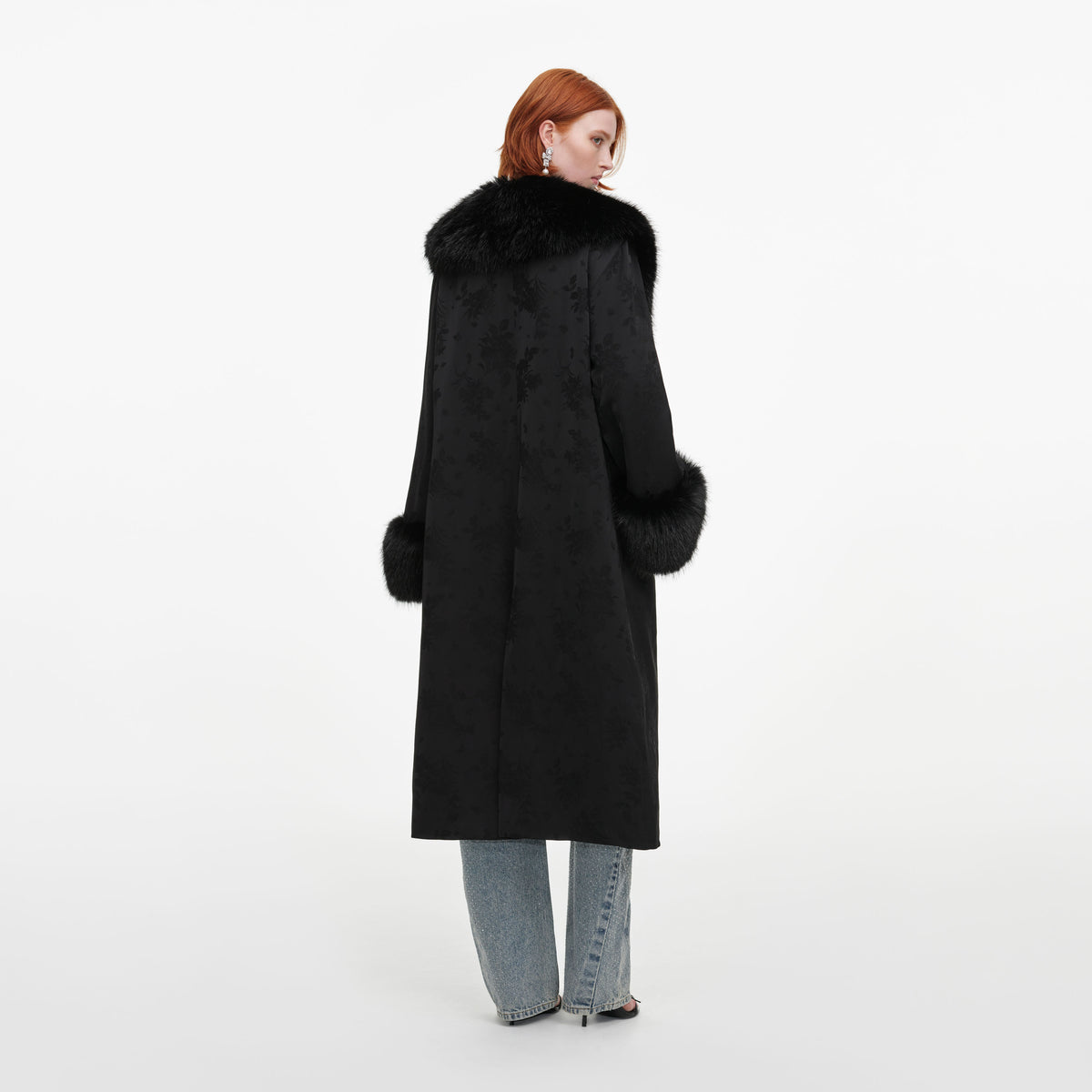 Back view of a woman wearing the Black Jacquard Fur Collar Coat