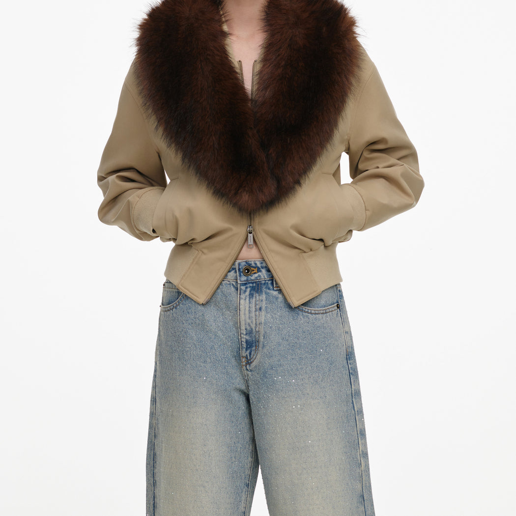 A close up of a woman wearing the Bleached Wash Jeans