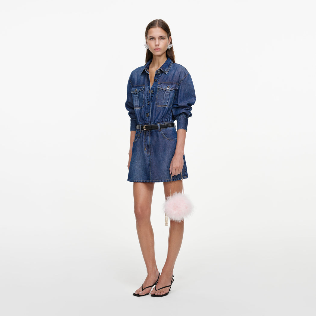 Side view of a woman wearing the Lightweight Denim Mini Dress