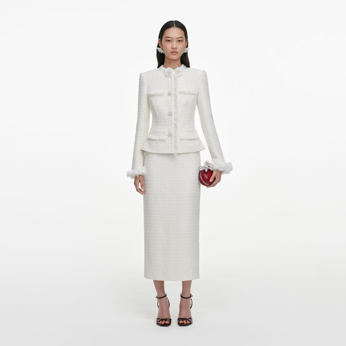 Front view of a woman wearing the Cream Boucle Flower Midi Dress