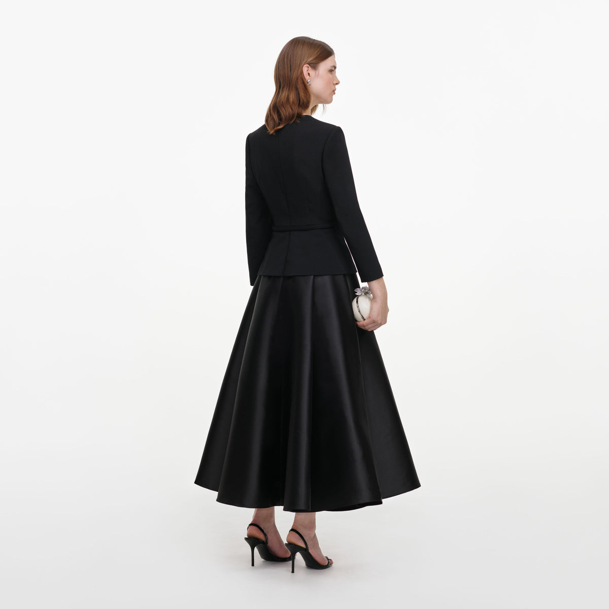 Back view of a woman wearing the Black Taffeta Brooch Midi Dress