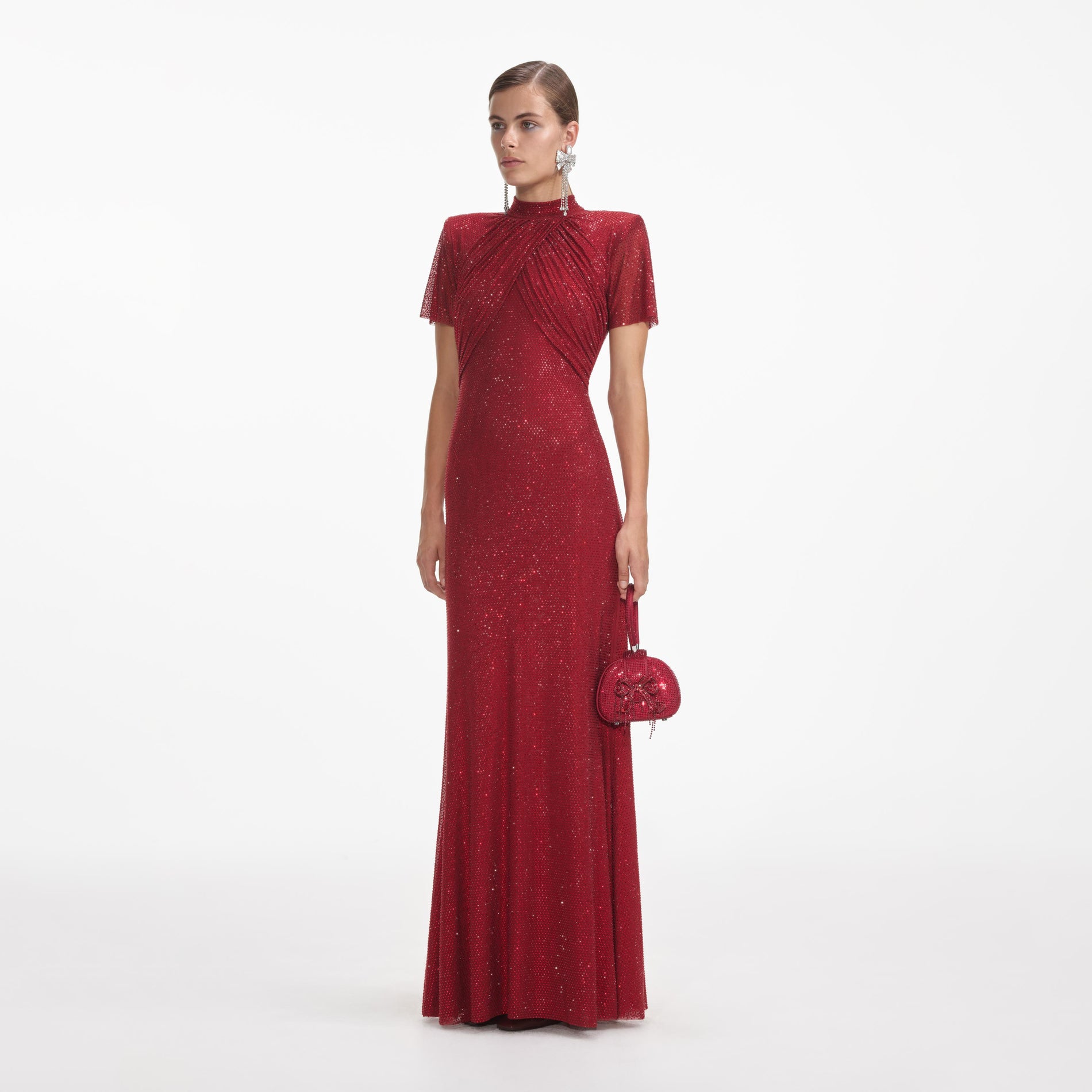 Side view of a woman wearing the Red Rhinestone Mesh Maxi Dress