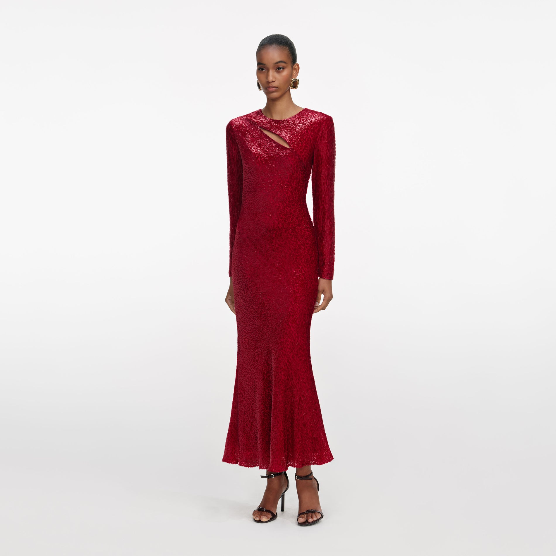 Side view of a woman wearing the Red Fil Coupe Midi Dress