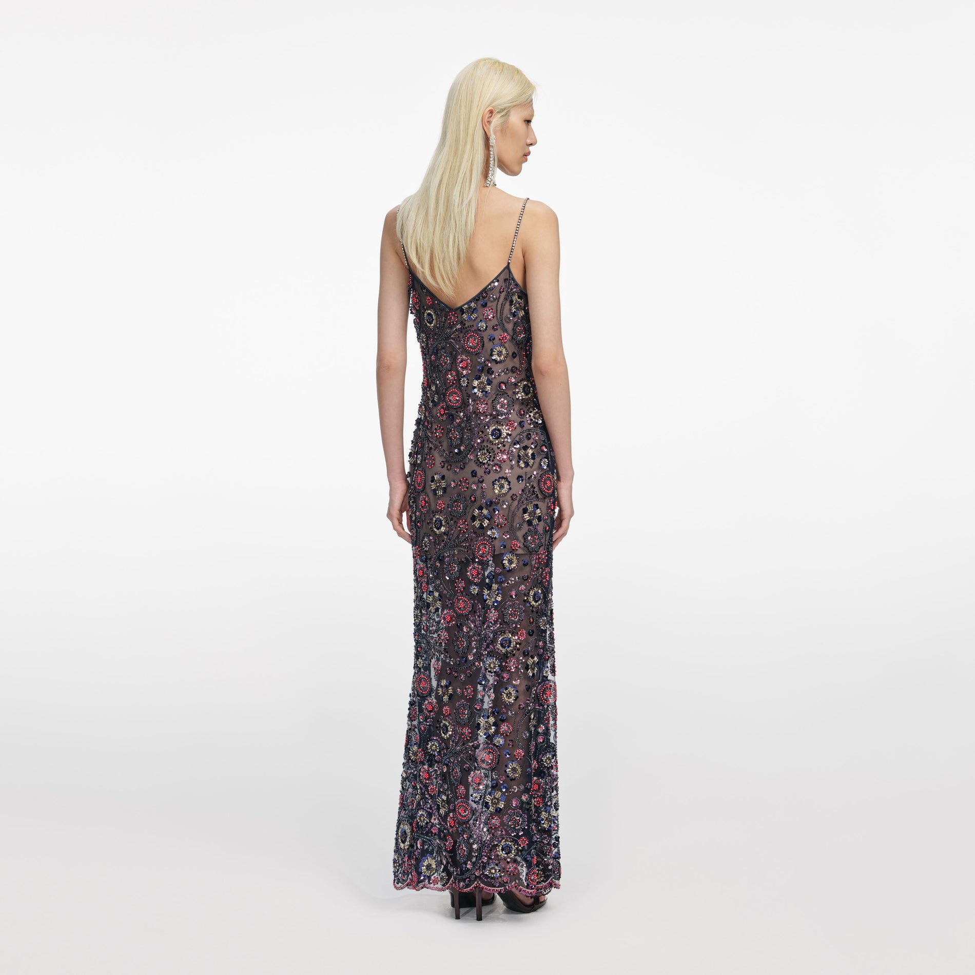 Back view of a woman wearing the Navy Floral Sequin Maxi Dress