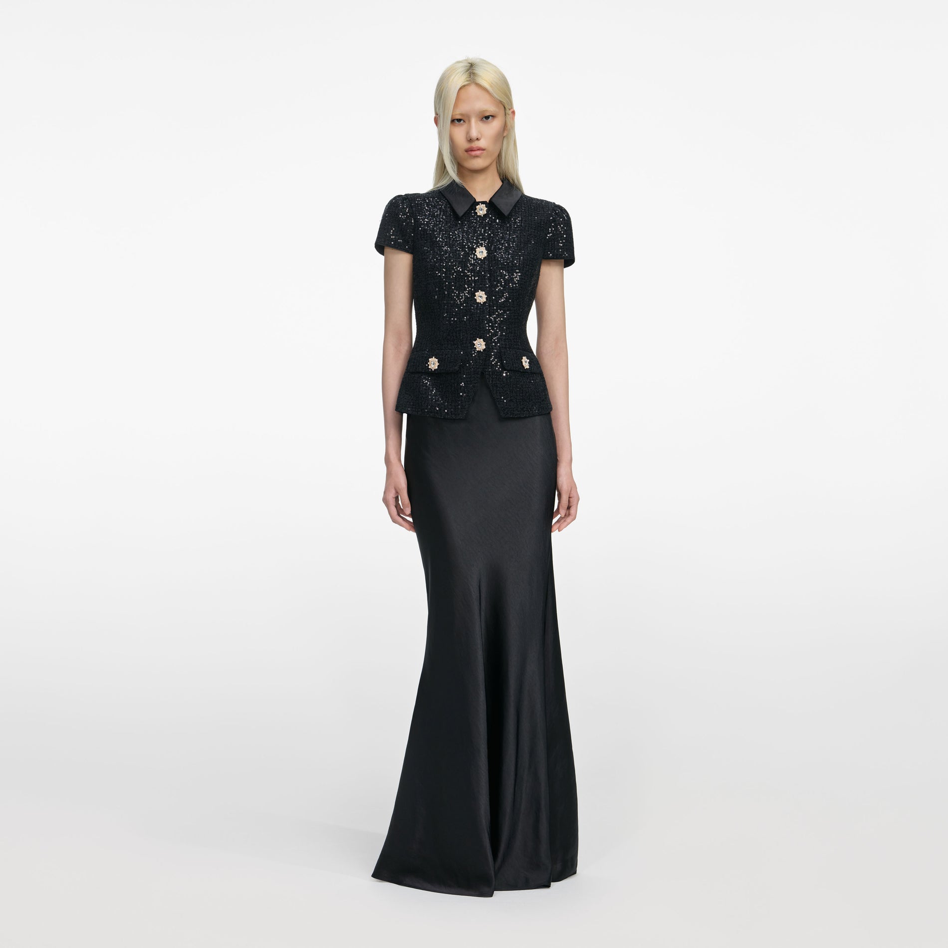 Front view of a woman wearing the Black Sequin Boucle Satin Maxi Dress
