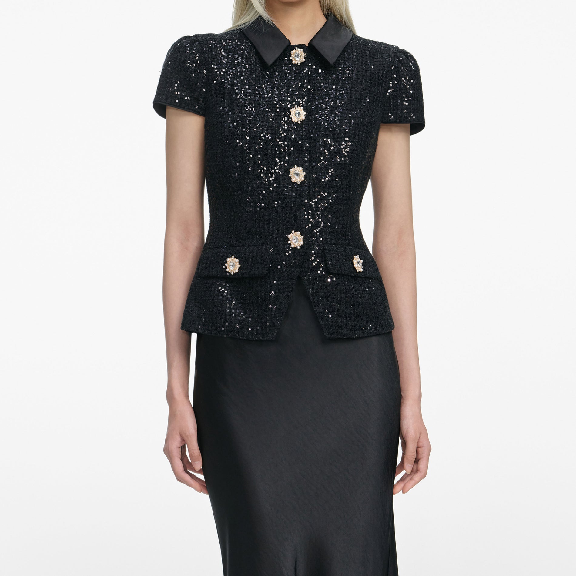 A close up of a woman wearing the Black Sequin Boucle Satin Maxi Dress