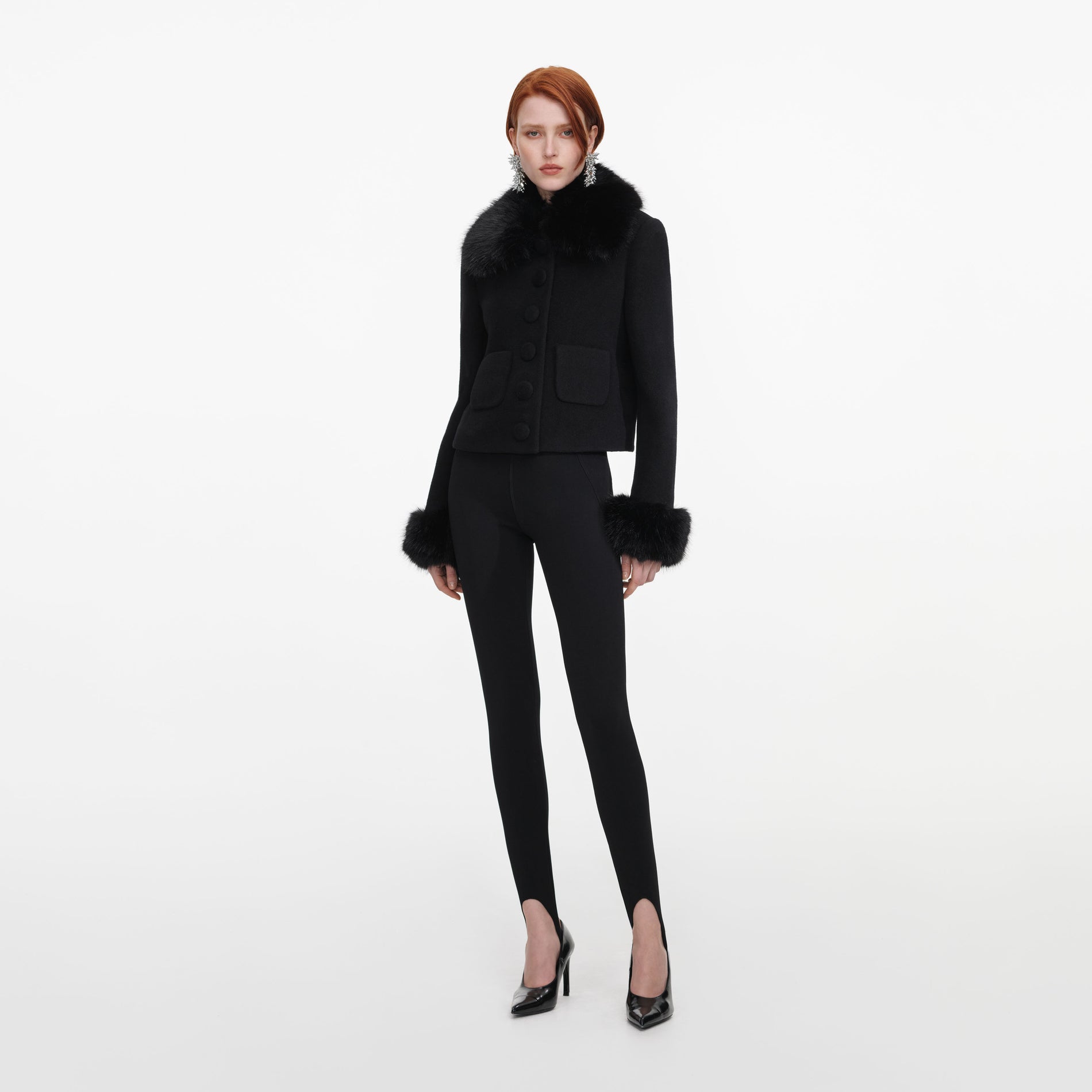 Side view of a woman wearing the Black Wool Fur Cuff Jacket
