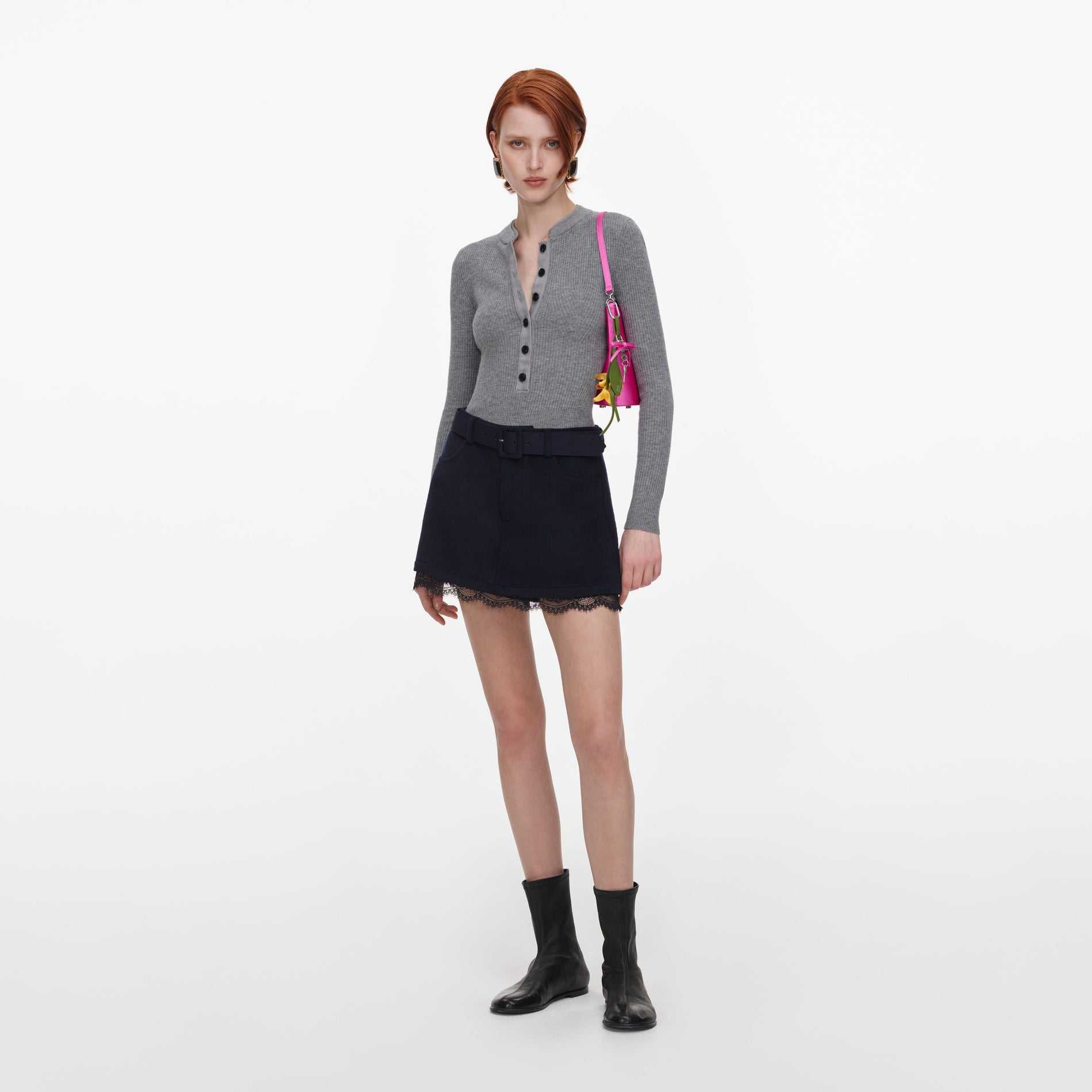 Side view of a woman wearing the Navy Wool Lace Skort