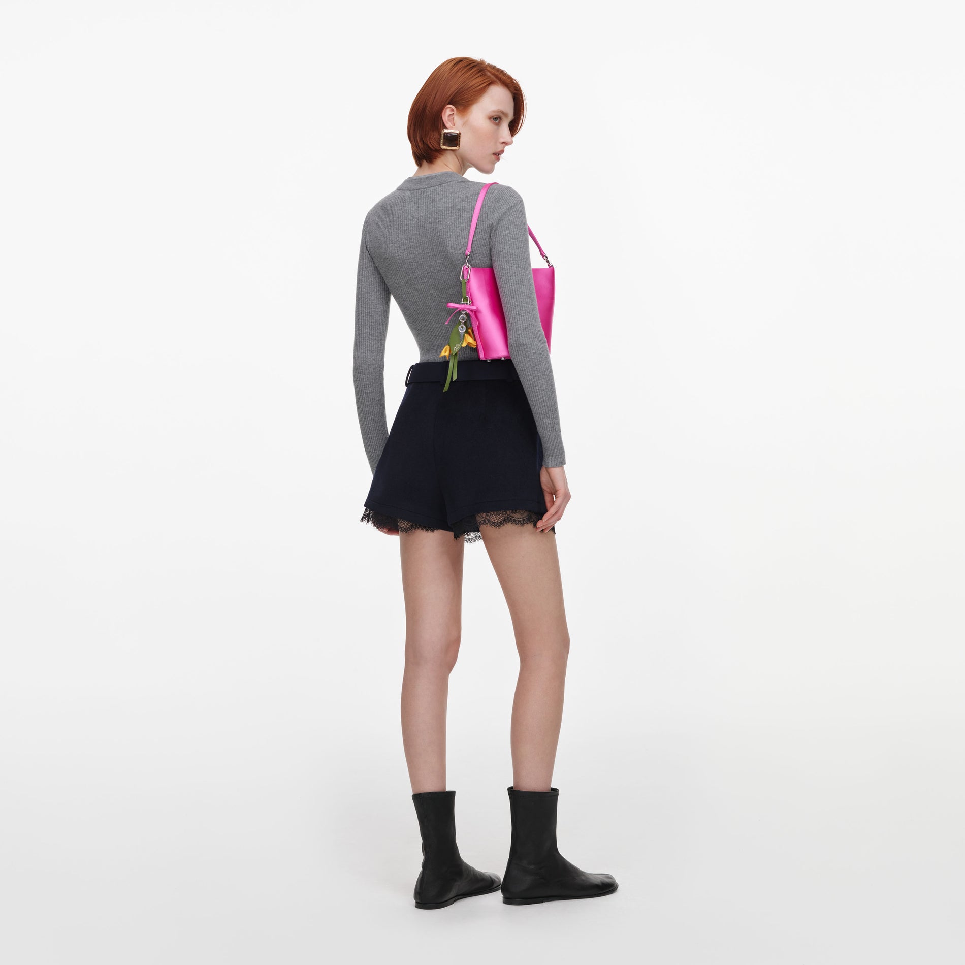 Back view of a woman wearing the Navy Wool Lace Skort