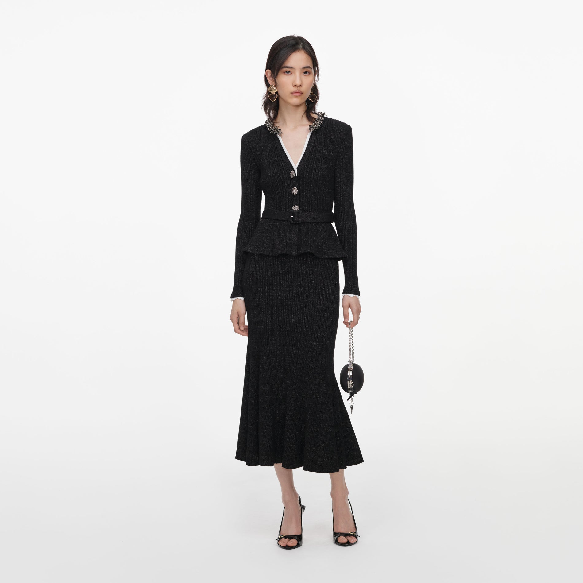 Front view of a woman wearing the Black Lurex Rib Knit Midi Dress