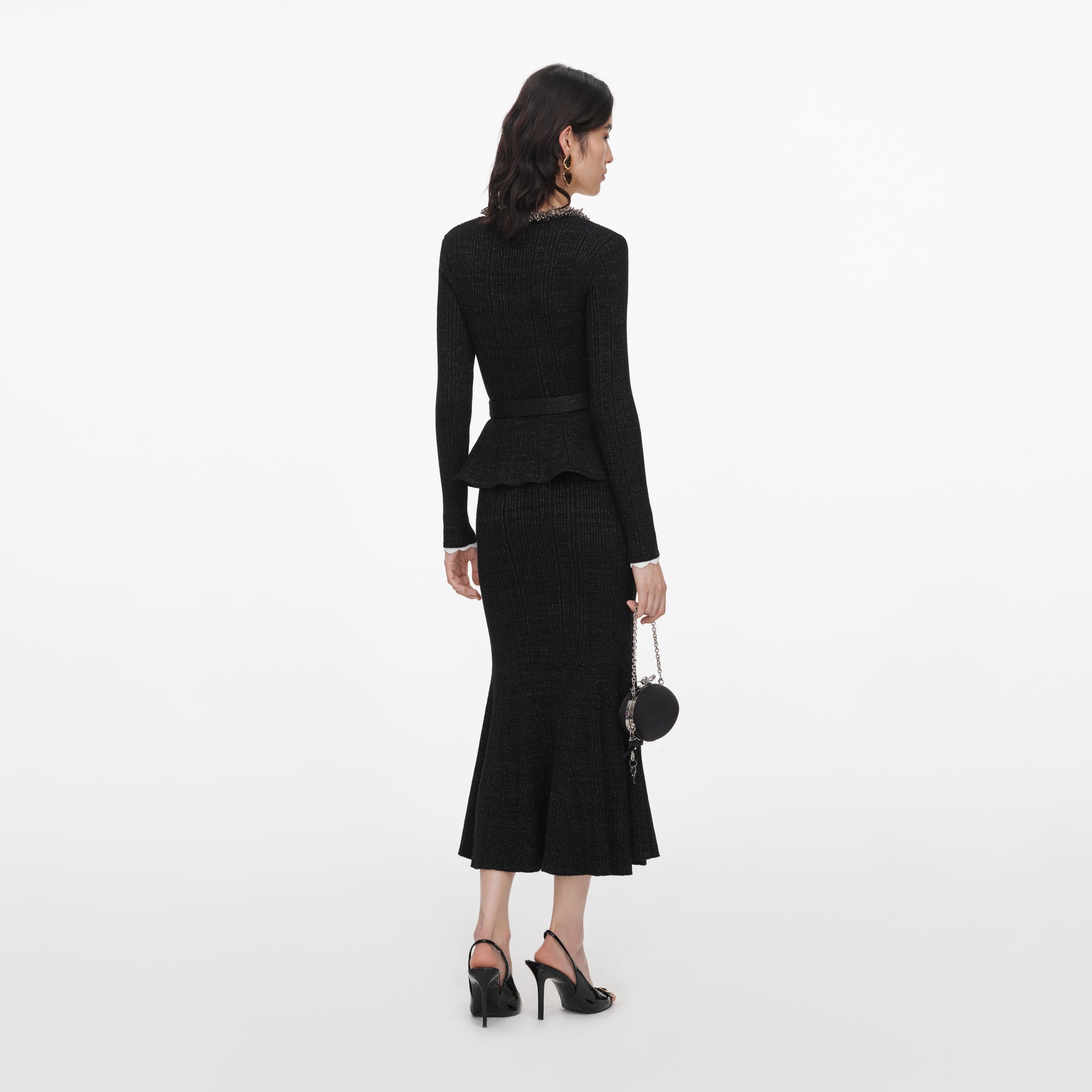Back view of a woman wearing the Black Lurex Rib Knit Midi Dress