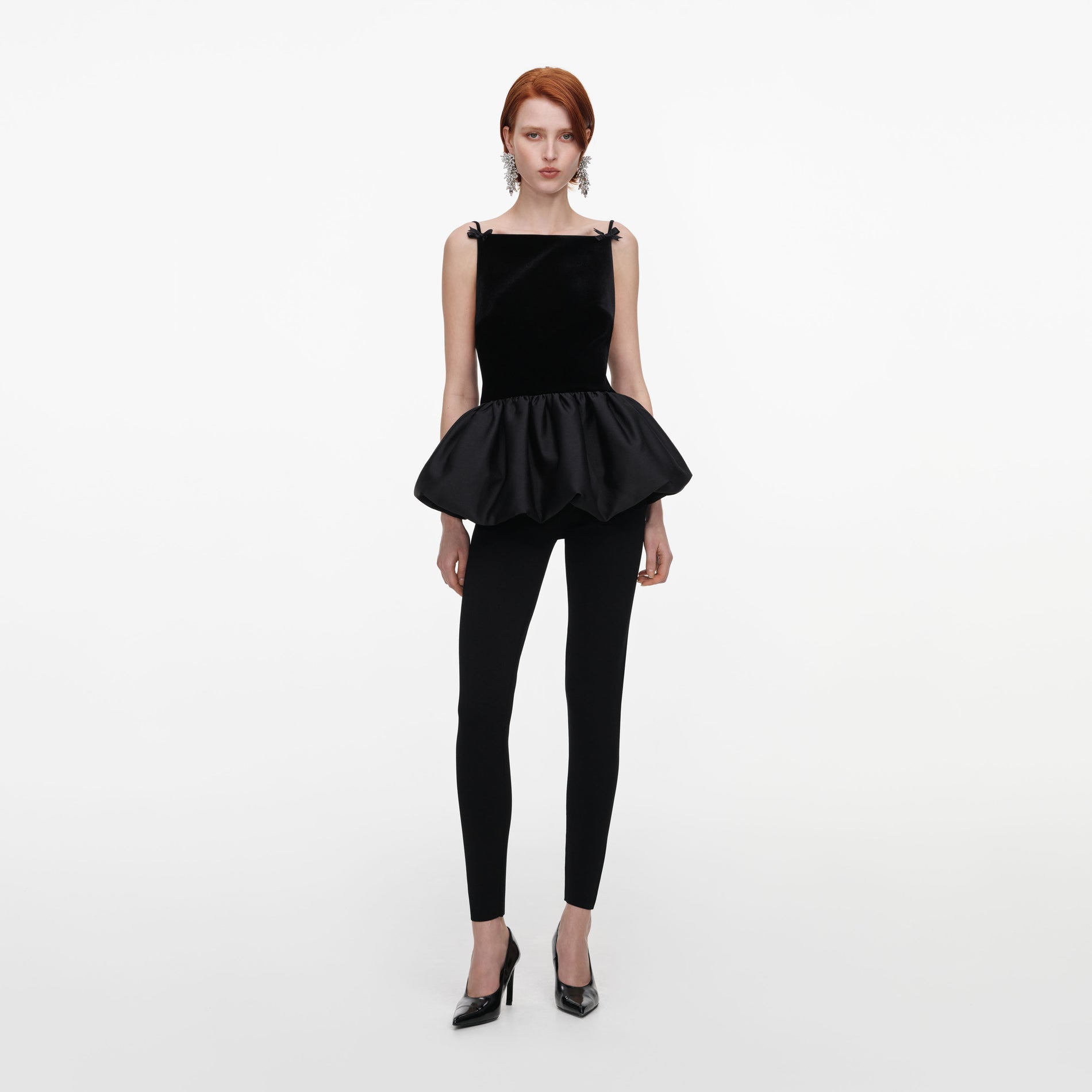 Front view of a woman wearing the Black Panel Knit Leggings