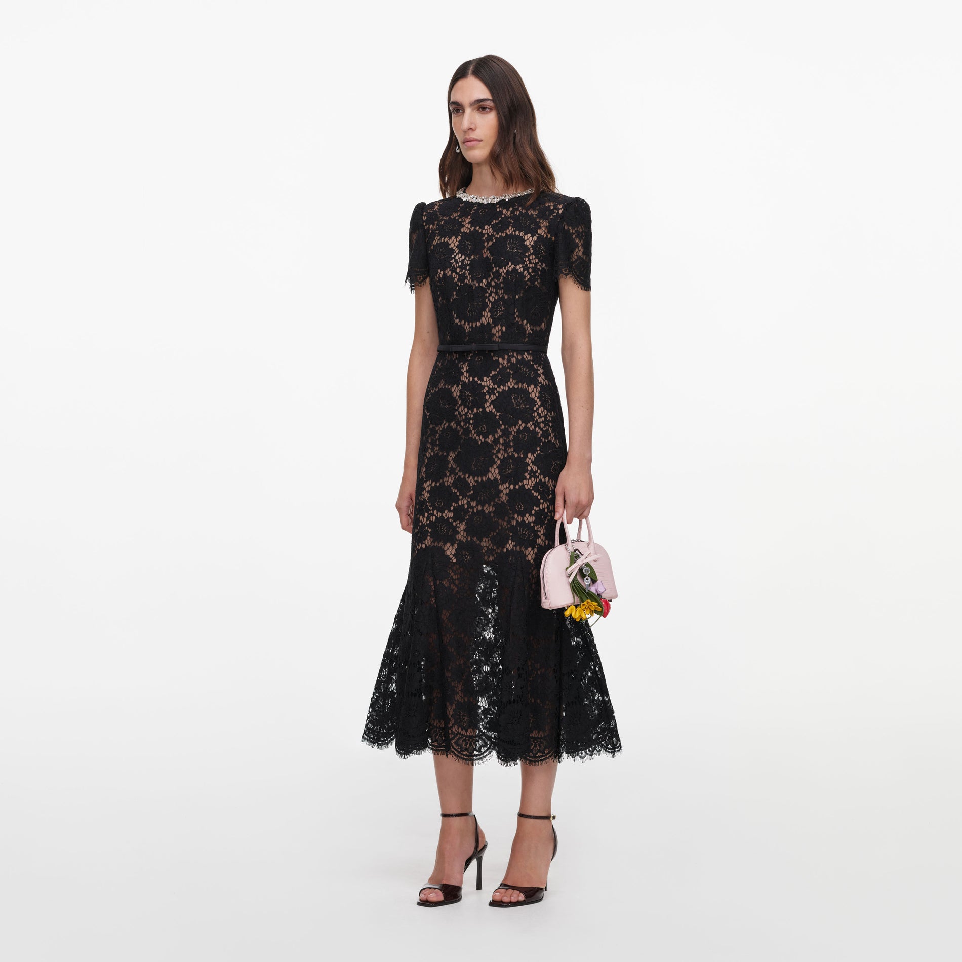 Side view of a woman wearing the Black Sequin Lace Midi Dress