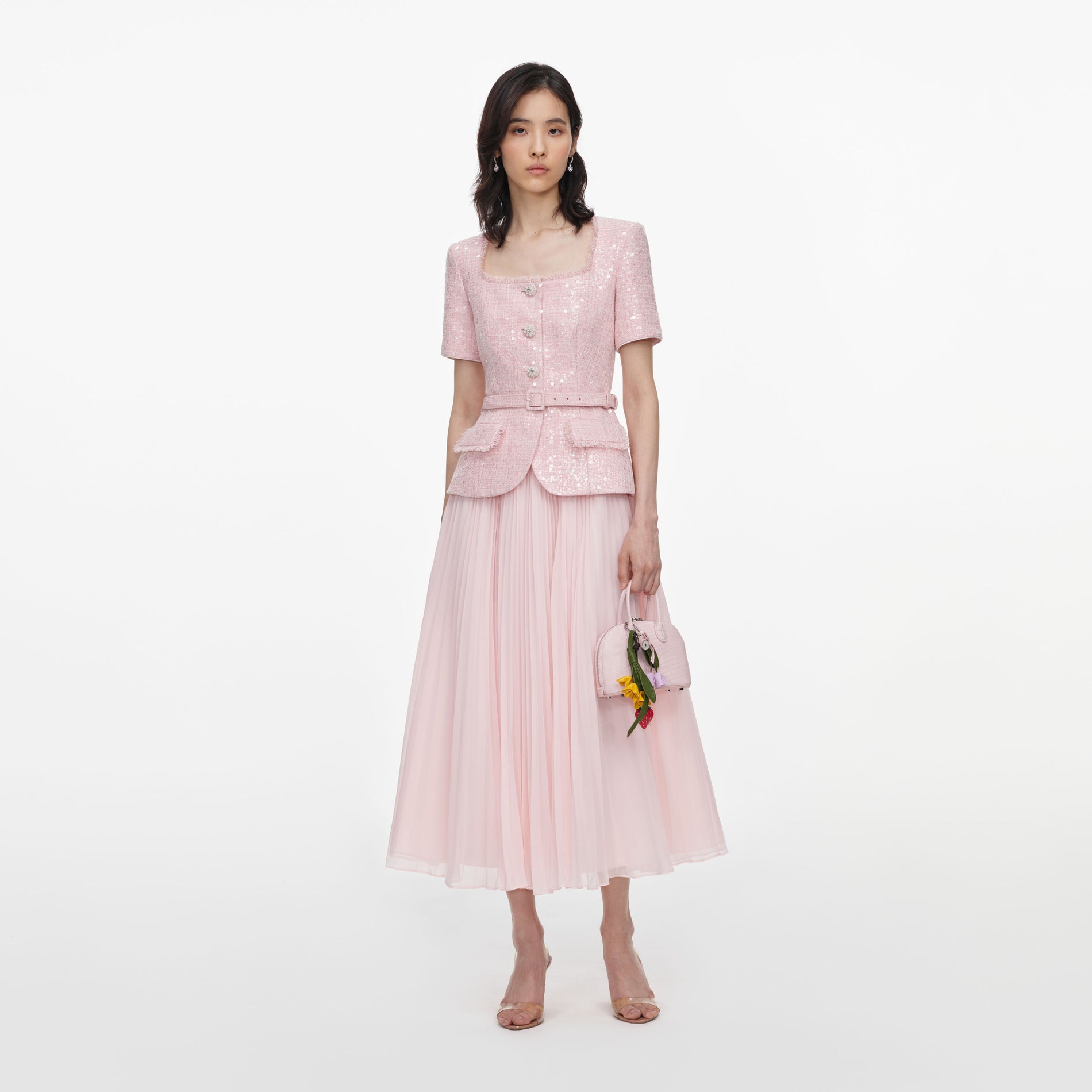 Front view of a woman wearing the Pink Sequin Boucle Midi Dress