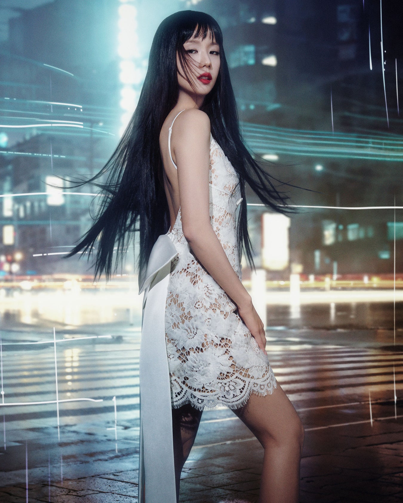 Jisoo in a white lace dress standing in a modern cityscape