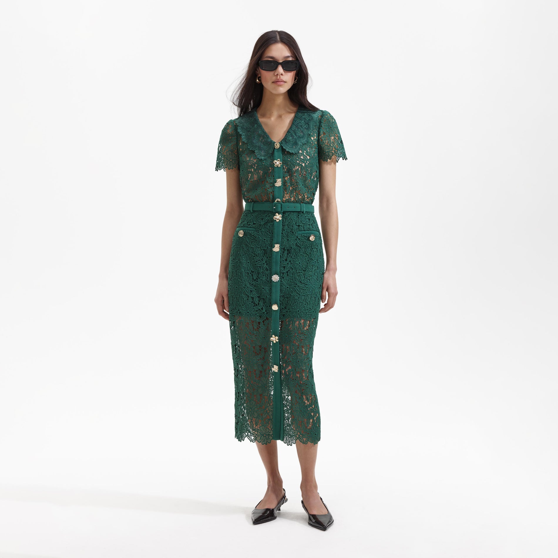 Front view of a woman wearing the Green Guipure Lace Midi Skirt