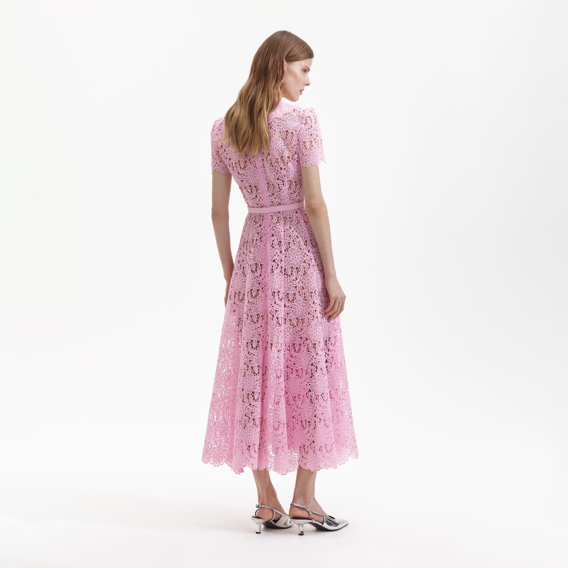 Back view of a woman wearing the Pink Guipure Midi Dress
