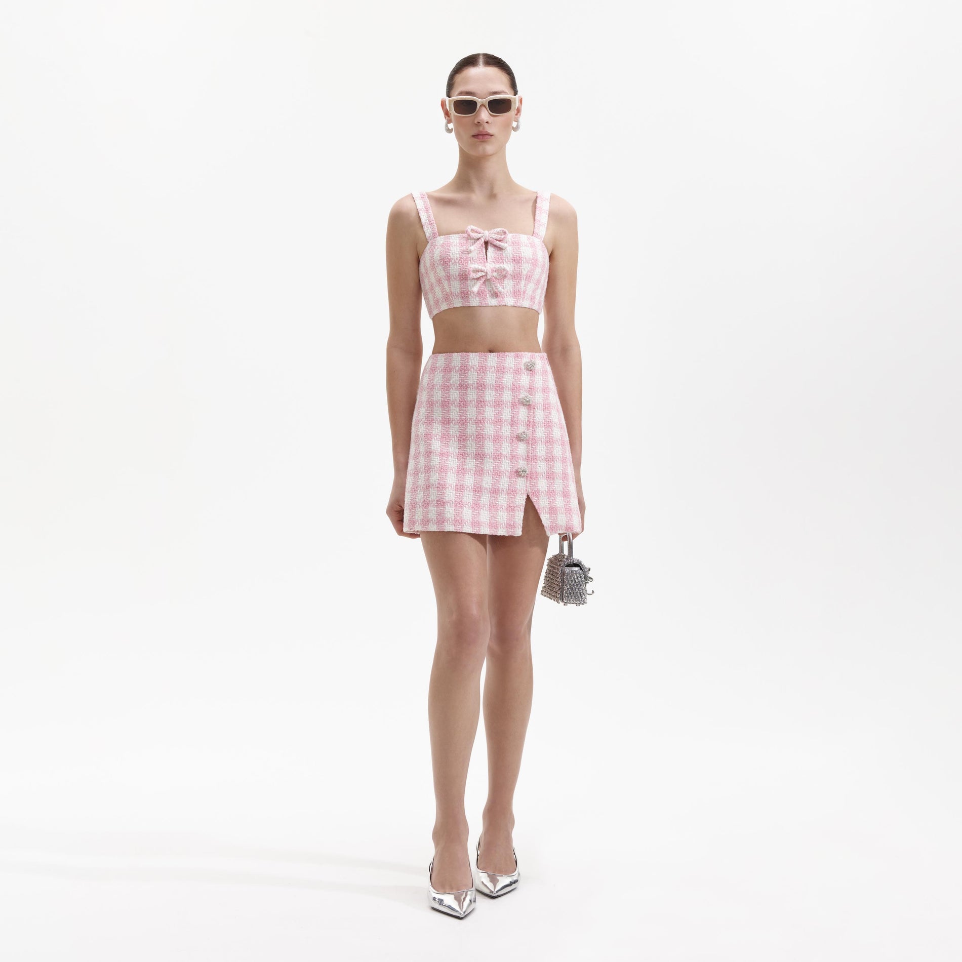 Front view of a woman wearing the Pink Check Boucle Mini Skirt