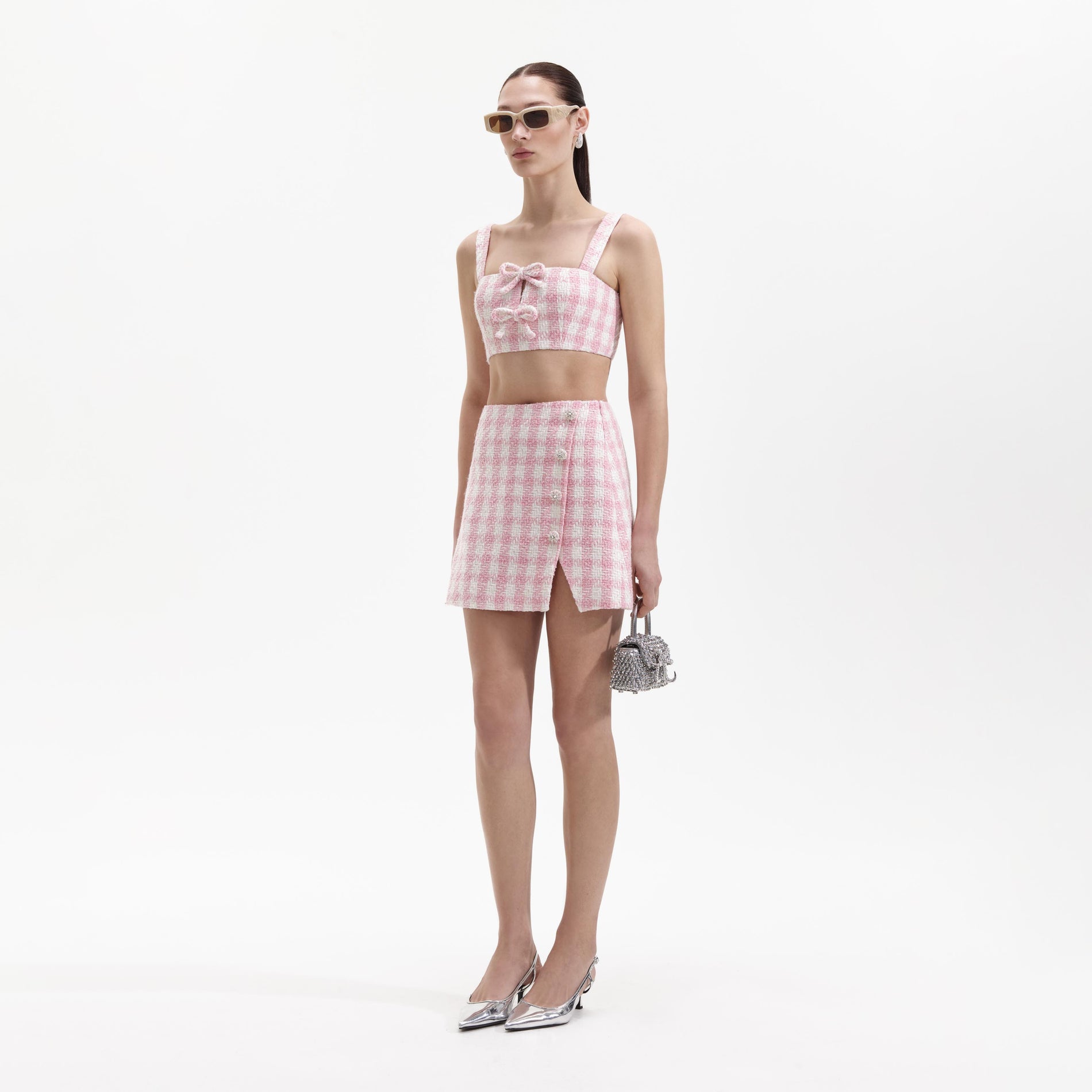 Side view of a woman wearing the Pink Check Boucle Mini Skirt