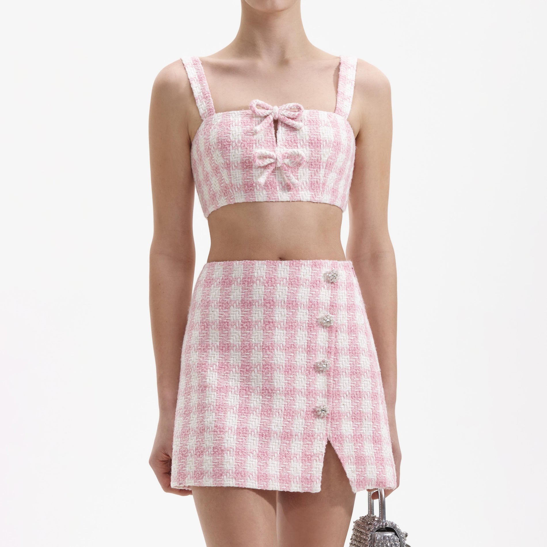 A close up of a woman wearing the Pink Check Boucle Mini Skirt