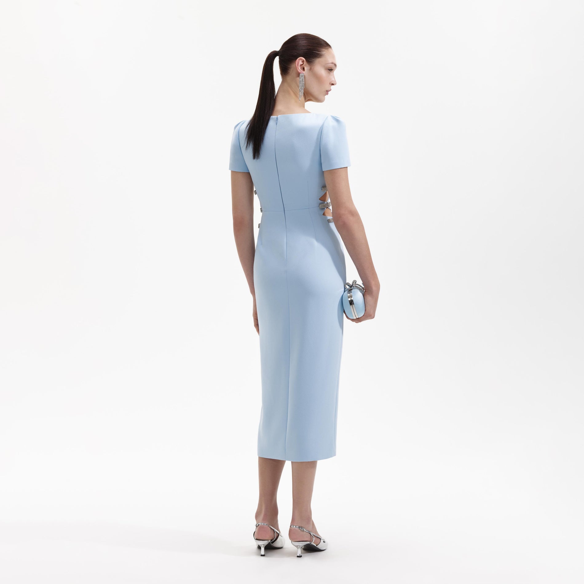 Back view of a woman wearing the Blue Crepe Split Midi Dress