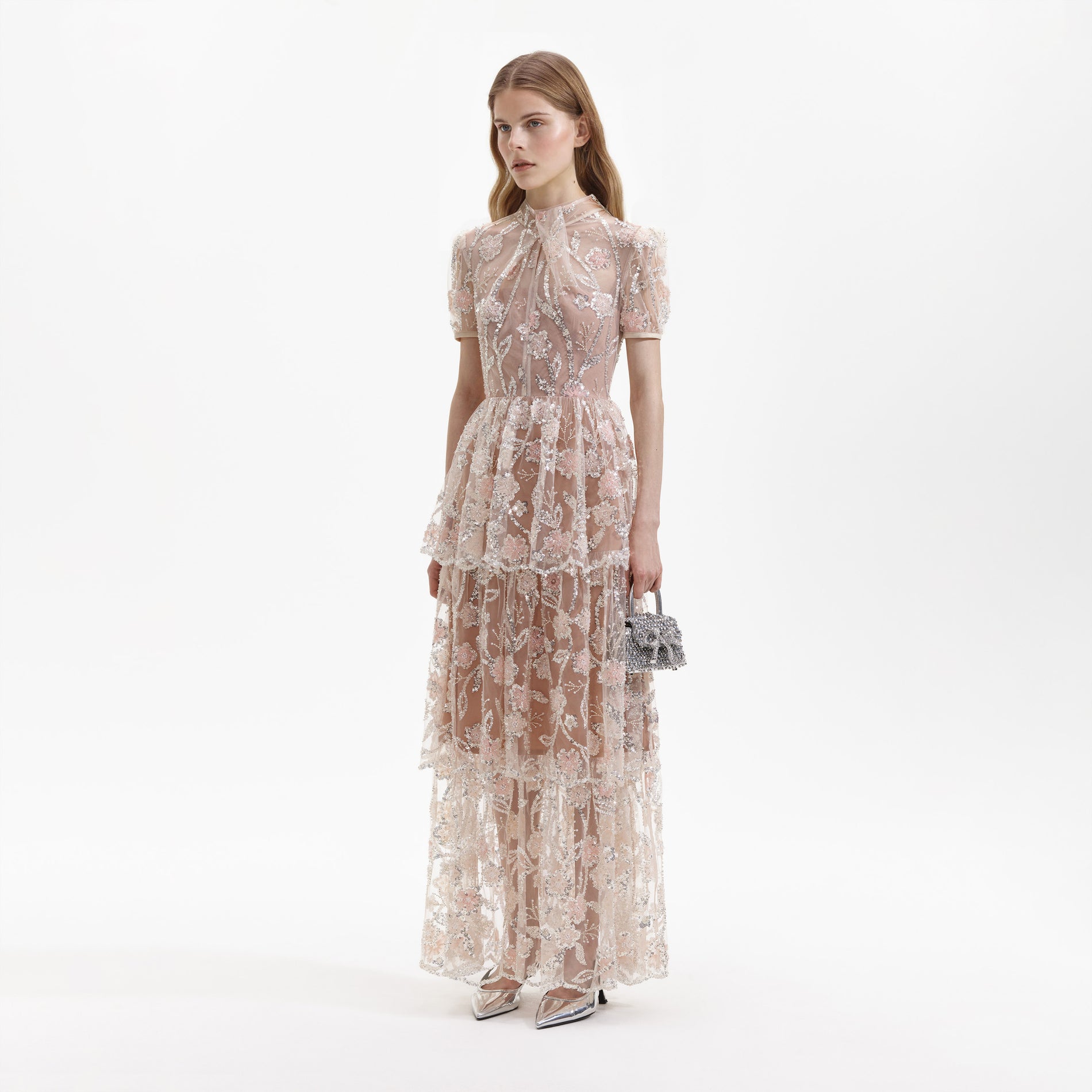 Side view of a woman wearing the Sequin Flower Maxi Dress