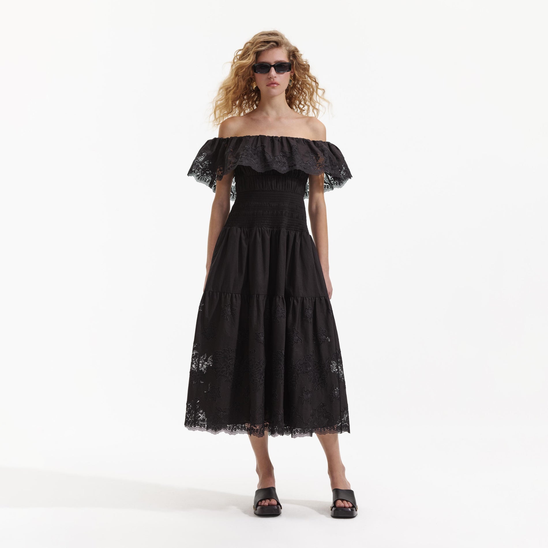 Front view of a woman wearing the Black Cotton Midi Dress