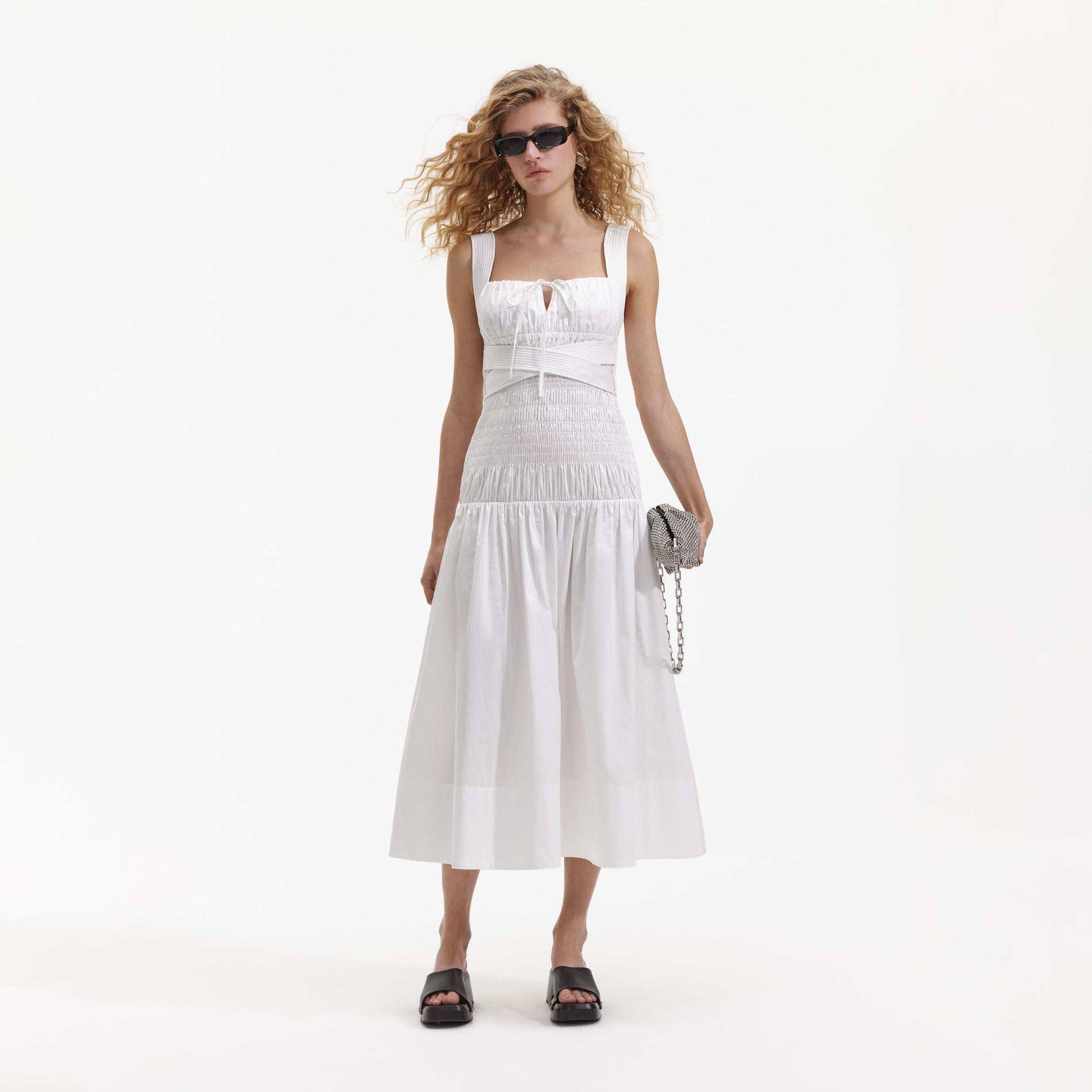 Front view of a woman wearing the White Cotton Sweetheart Midi Dress