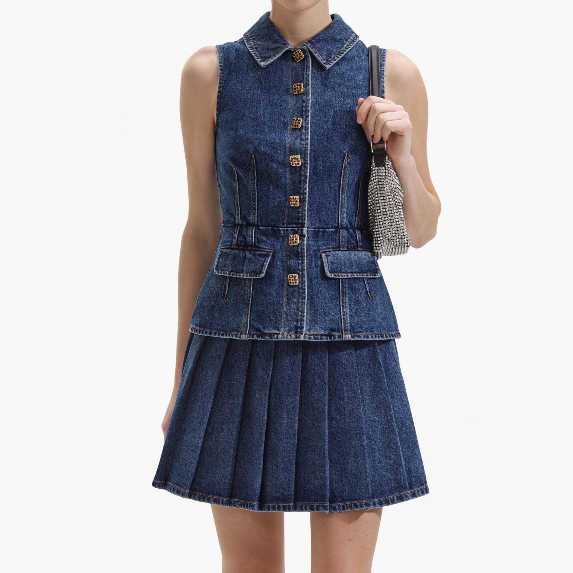 A close up of a woman wearing the Tailored Denim Mini Dress