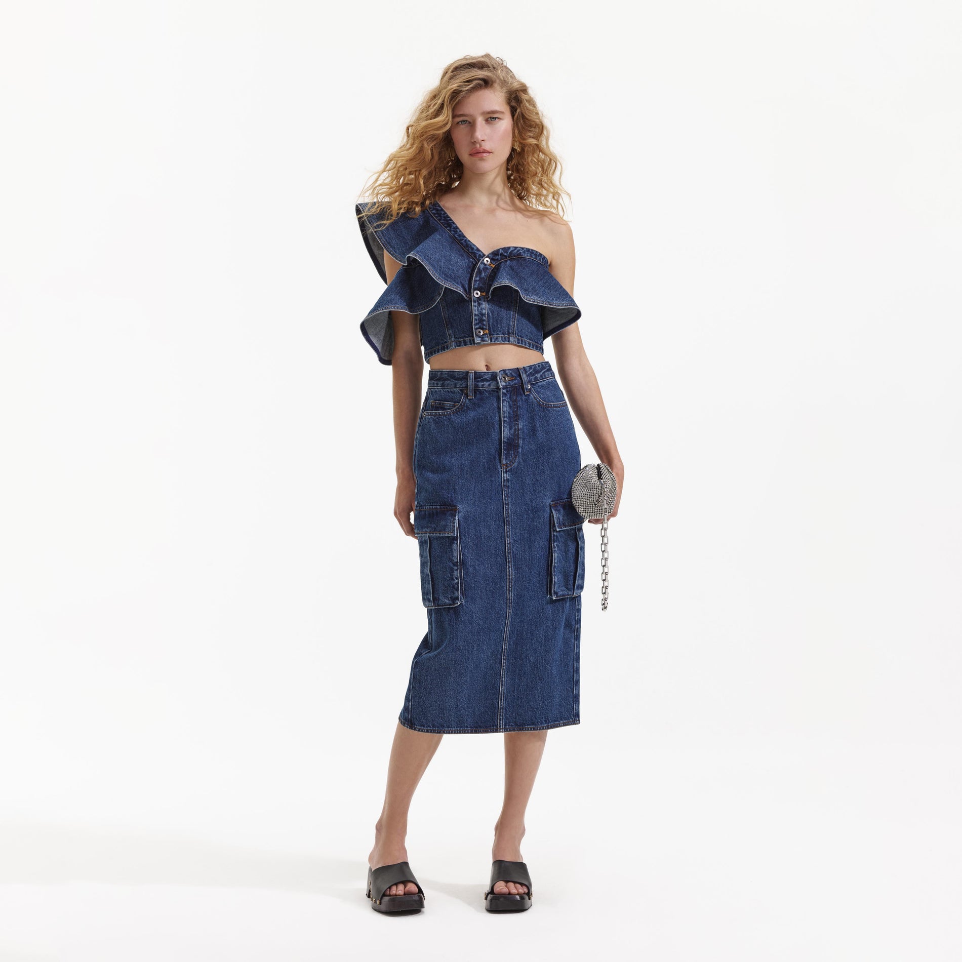 Front view of a woman wearing the Denim Cargo Midi Skirt