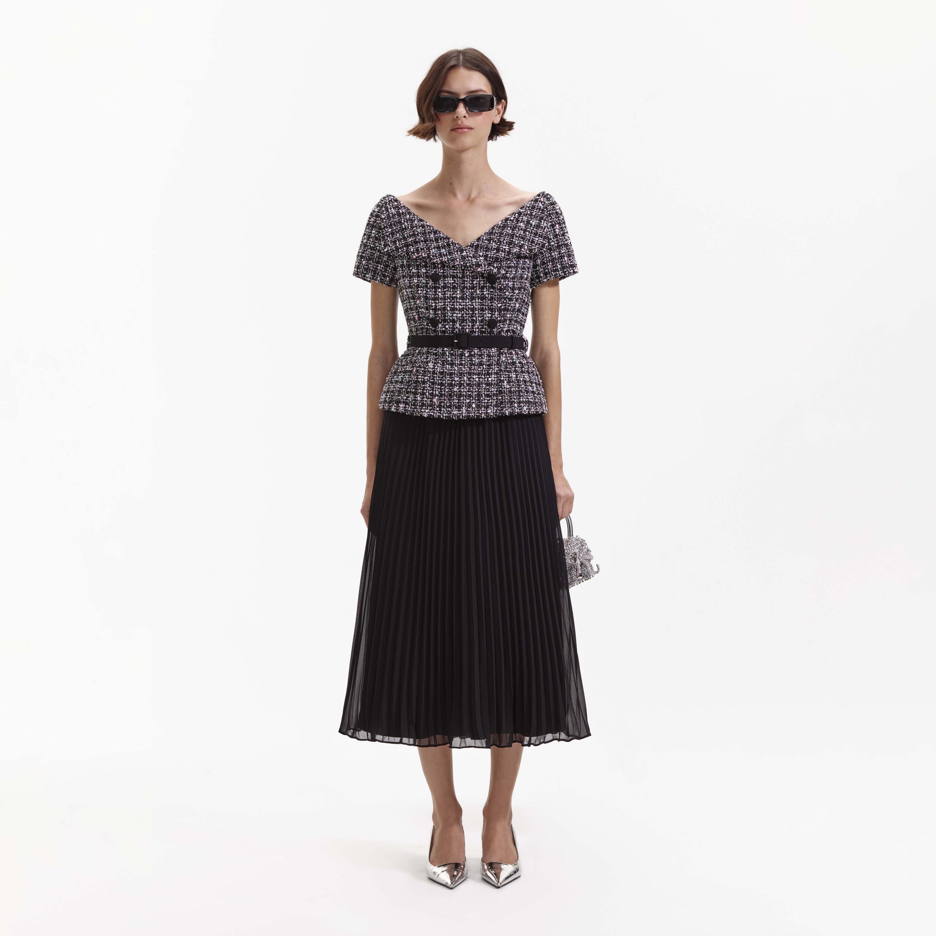 Front view of a woman wearing the Black Boucle Off Shoulder Midi Dress