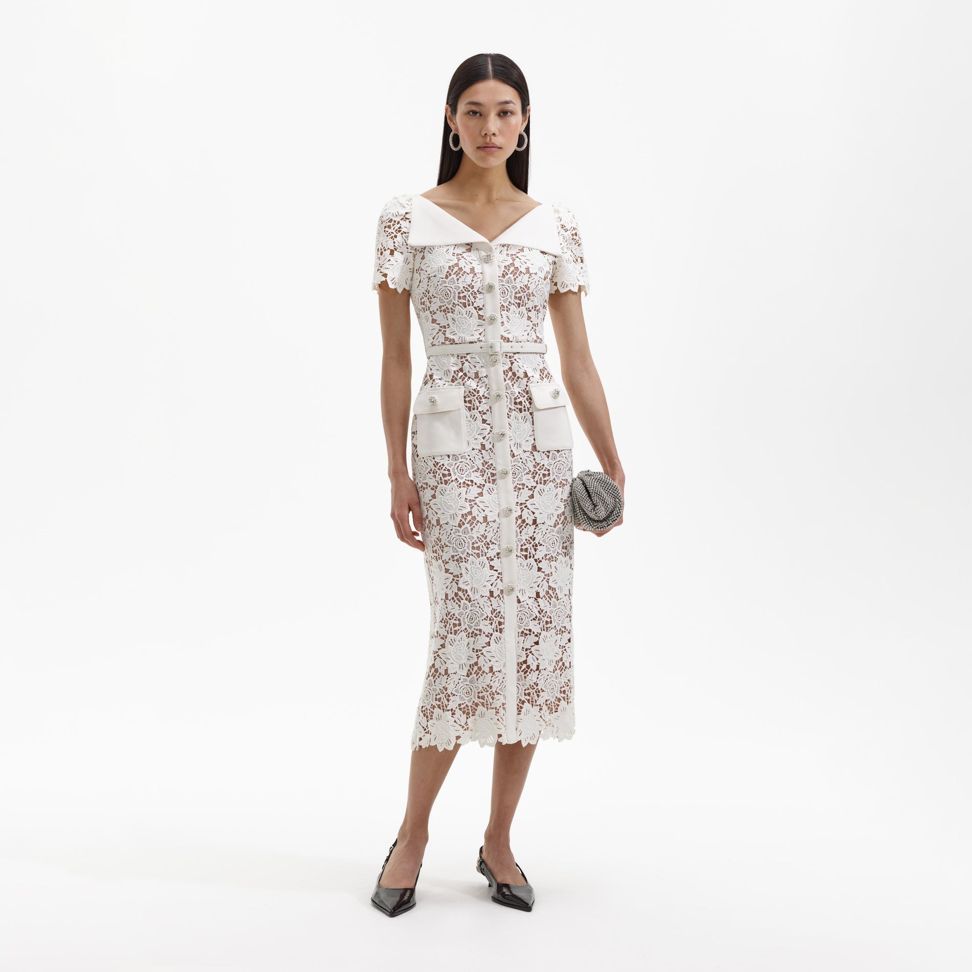 Front view of a woman wearing the White Lace Open Neck Midi Dress