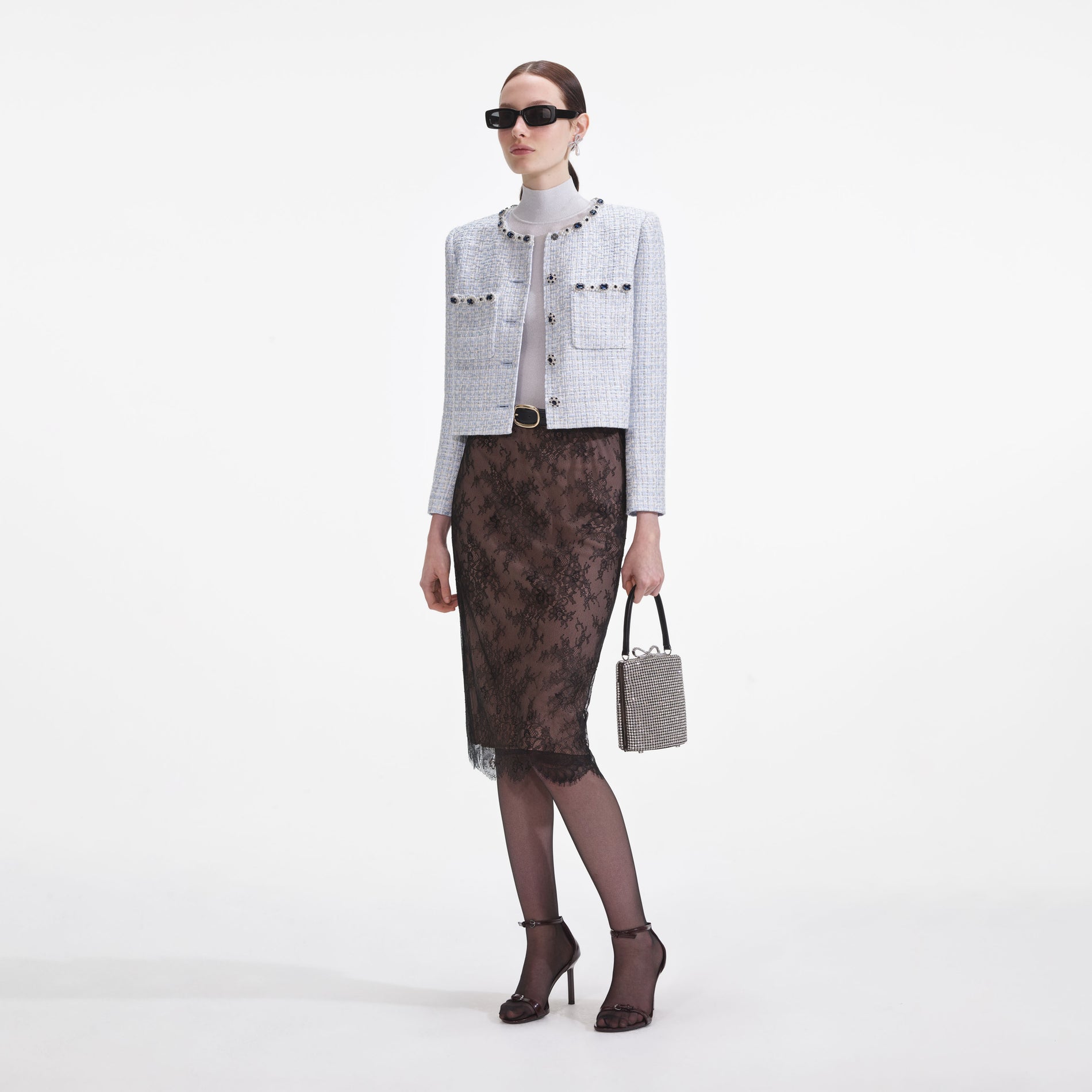 Side view of a woman wearing the Blue Boucle Jacket