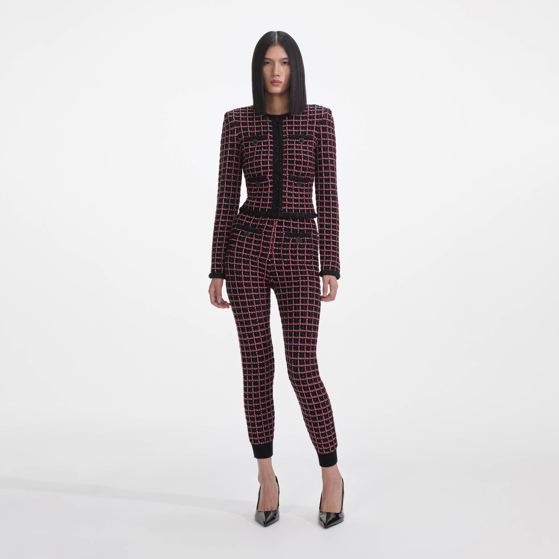 Front view of a woman wearing the Black And Red Check Cardigan