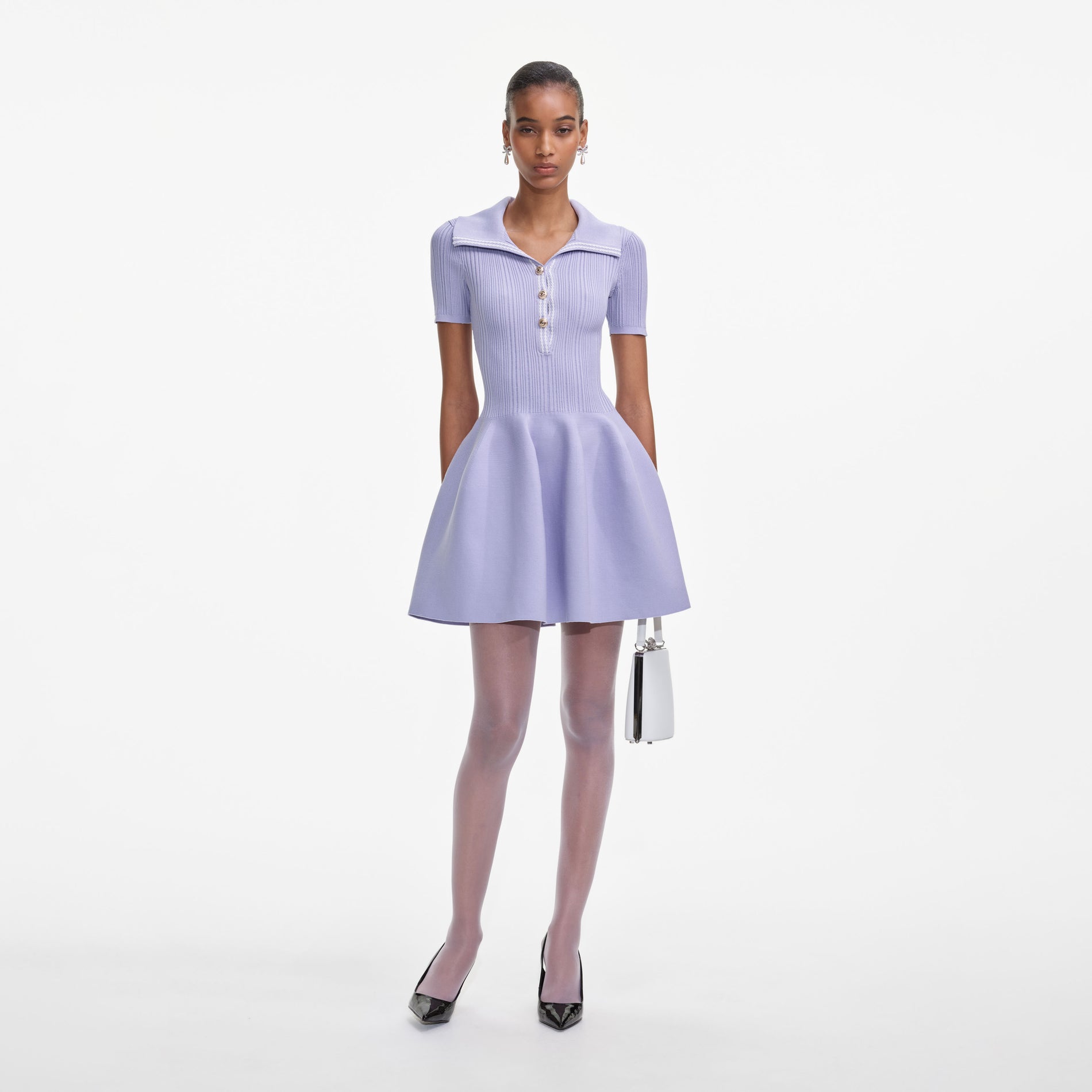 Front view of a woman wearing the Lilac Ribbed Knit Mini Dress
