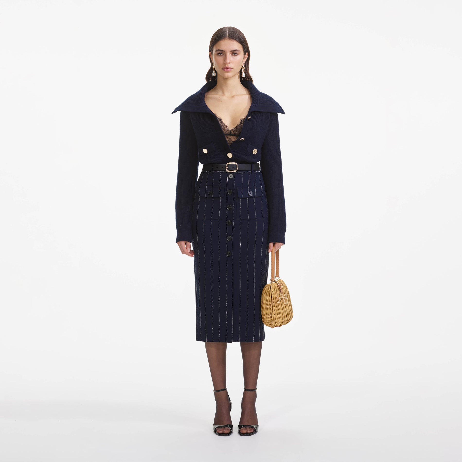 Front view of a woman wearing the Navy Relaxed Fit Cardigan