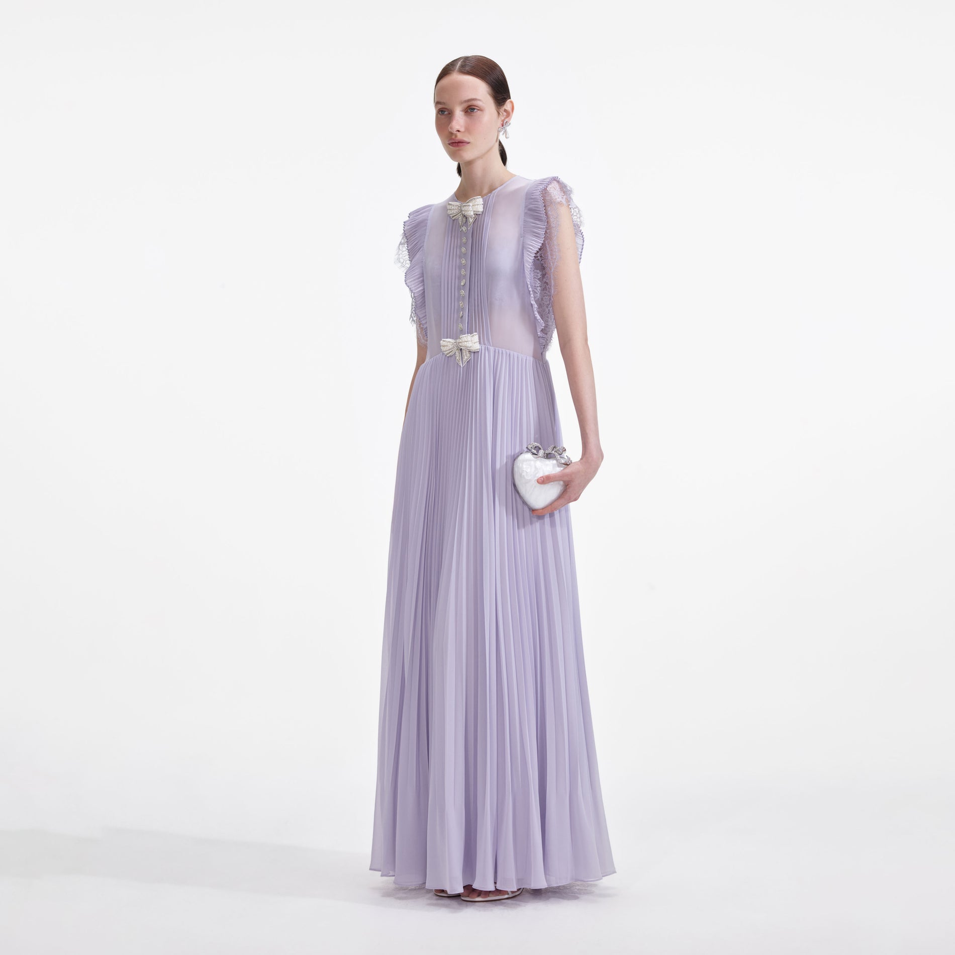 Side view of a woman wearing the Lilac Chiffon Ruffle Maxi Dress