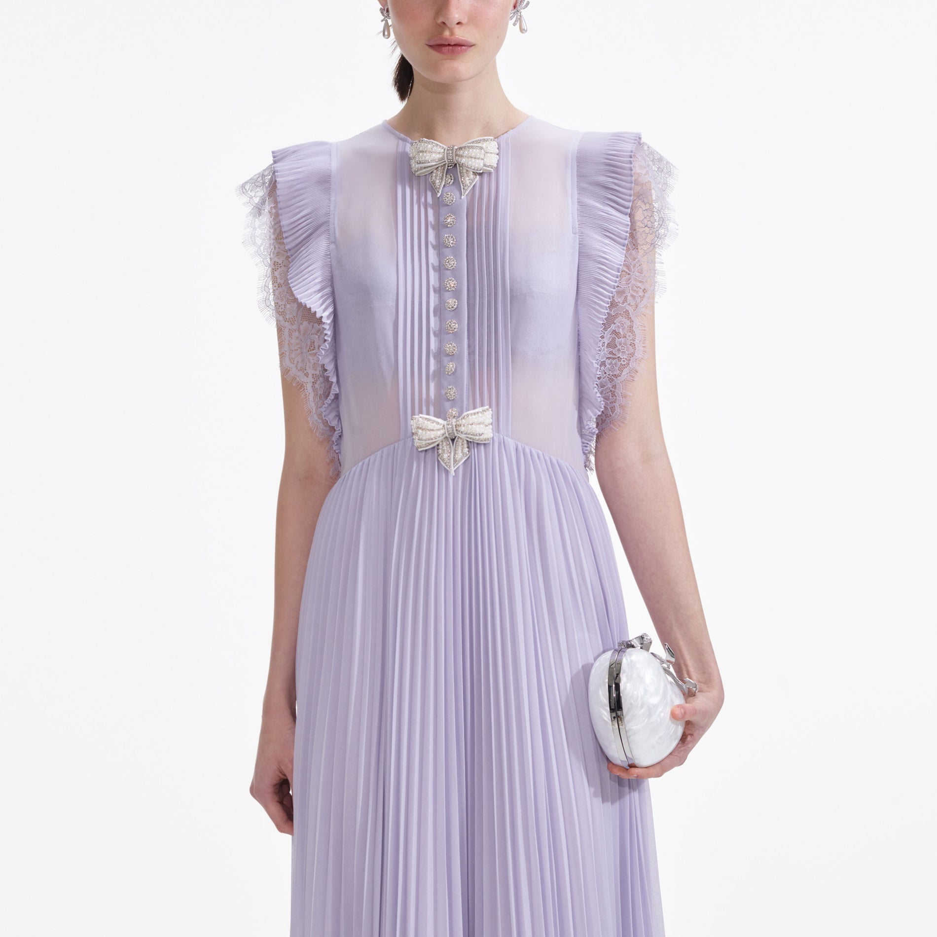 A close up of a woman wearing the Lilac Chiffon Ruffle Maxi Dress