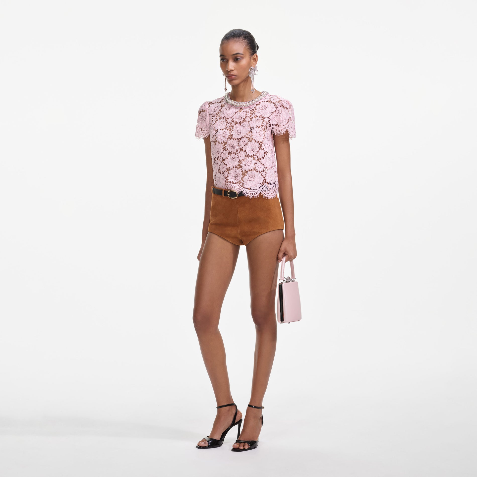 Side view of a woman wearing the Pink Lace Top