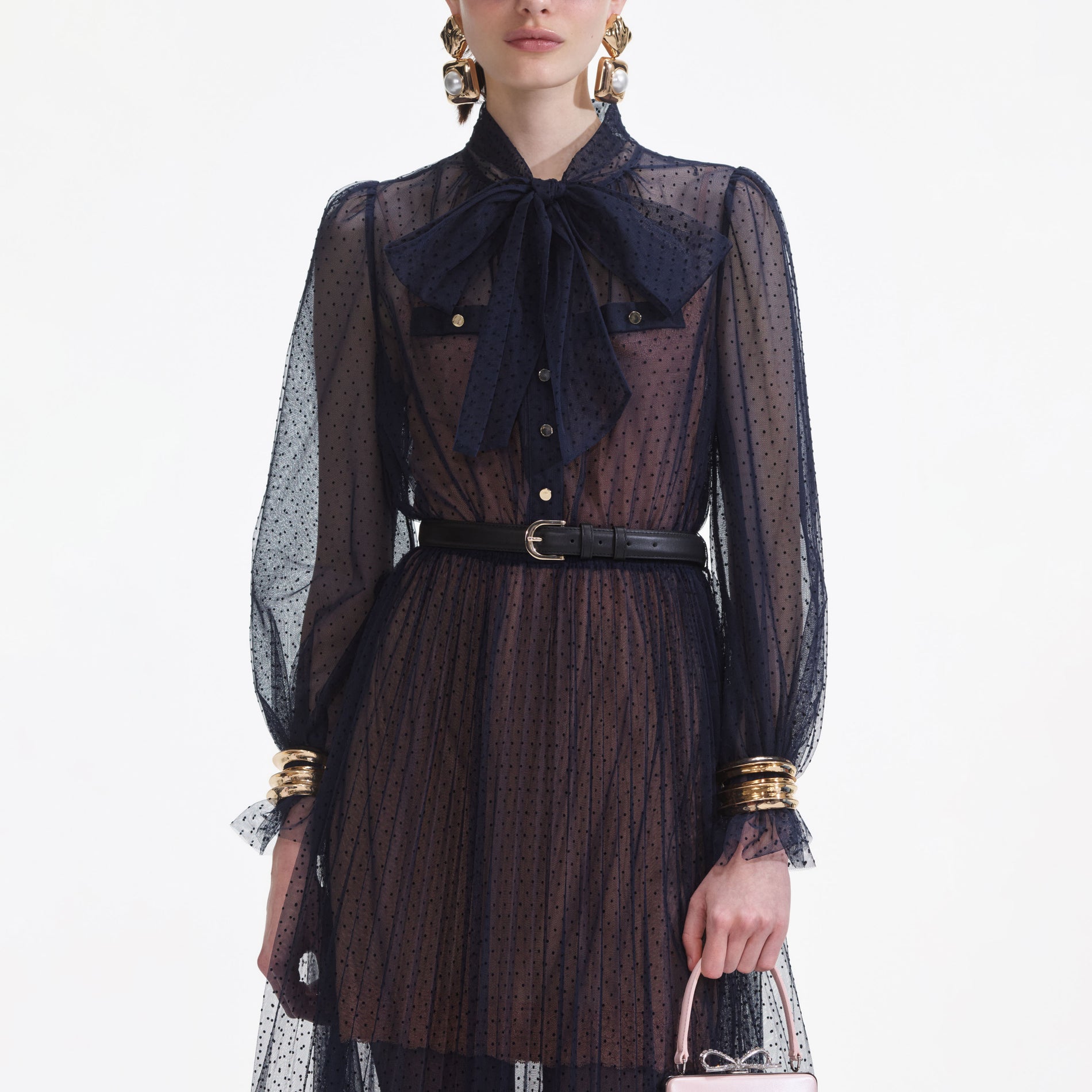 A close up of a woman wearing the Navy Dot Mesh Midi Dress