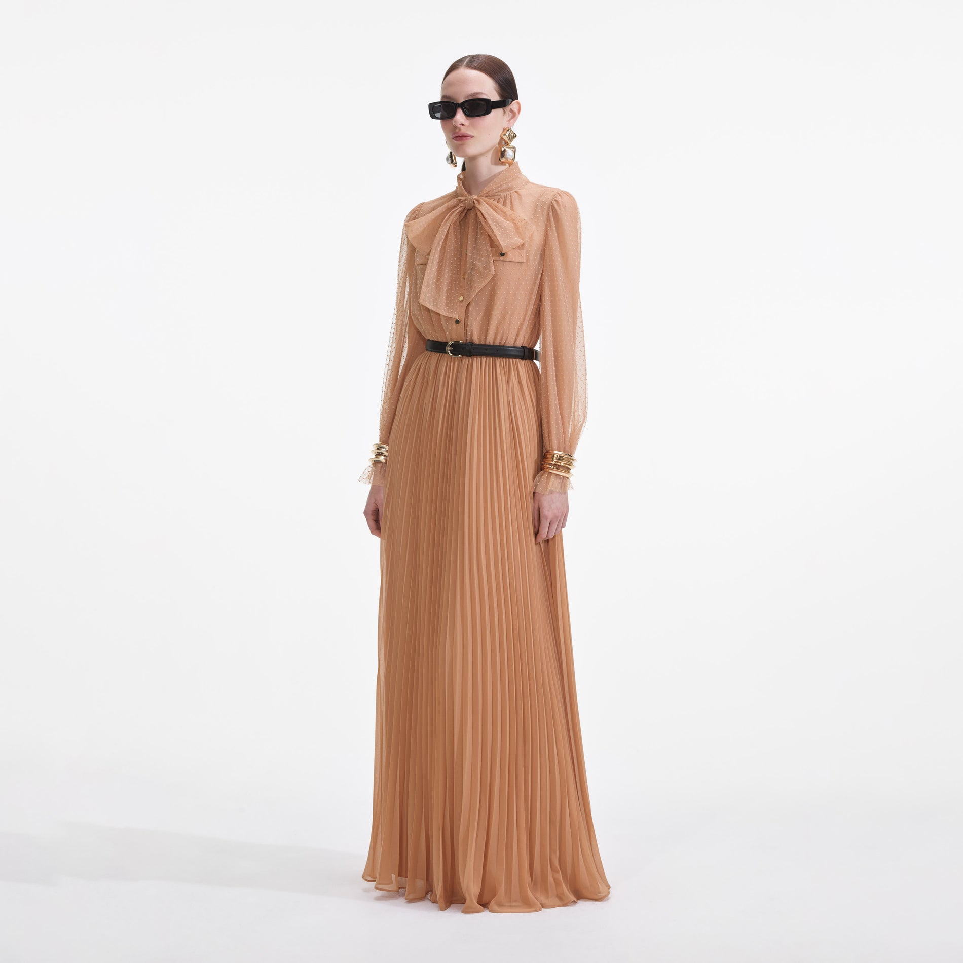 Side view of a woman wearing the Tan Dot Mesh Maxi Dress